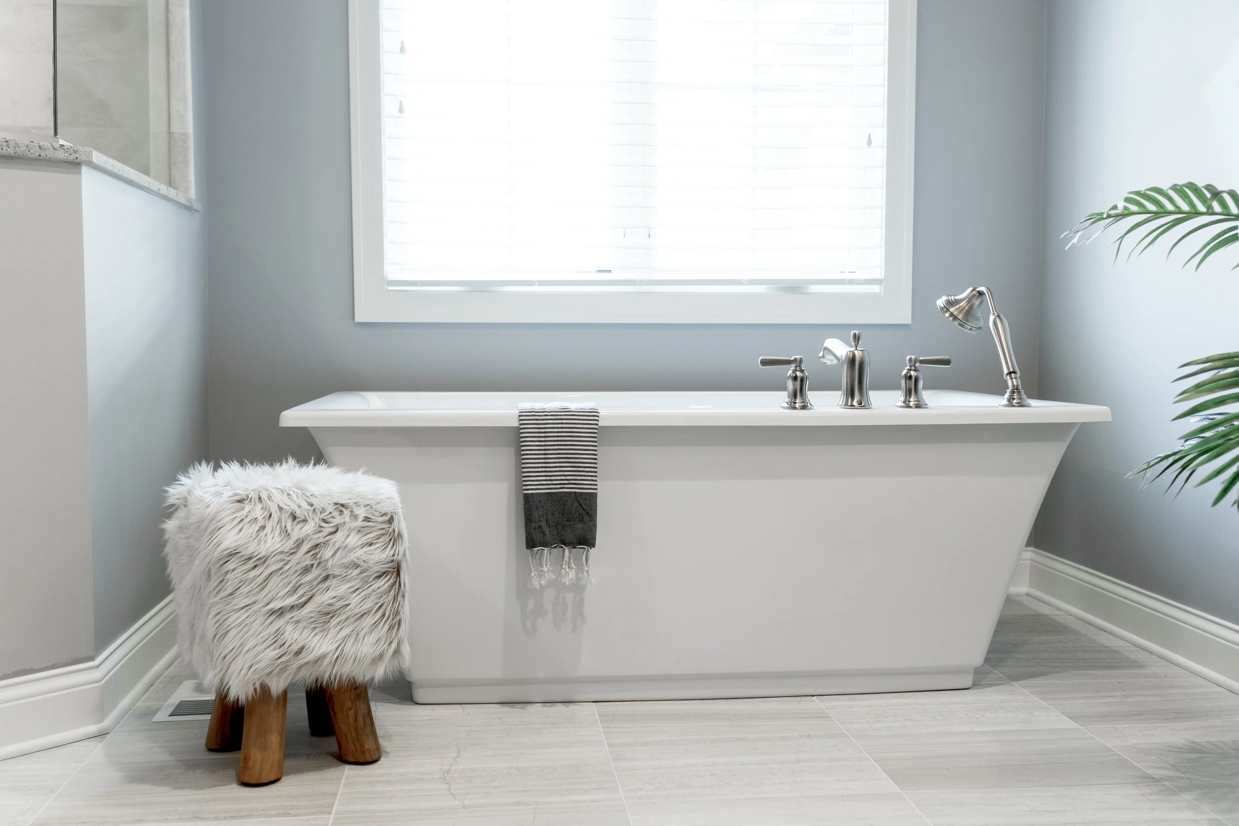 Freestanding tub with chrome accents
