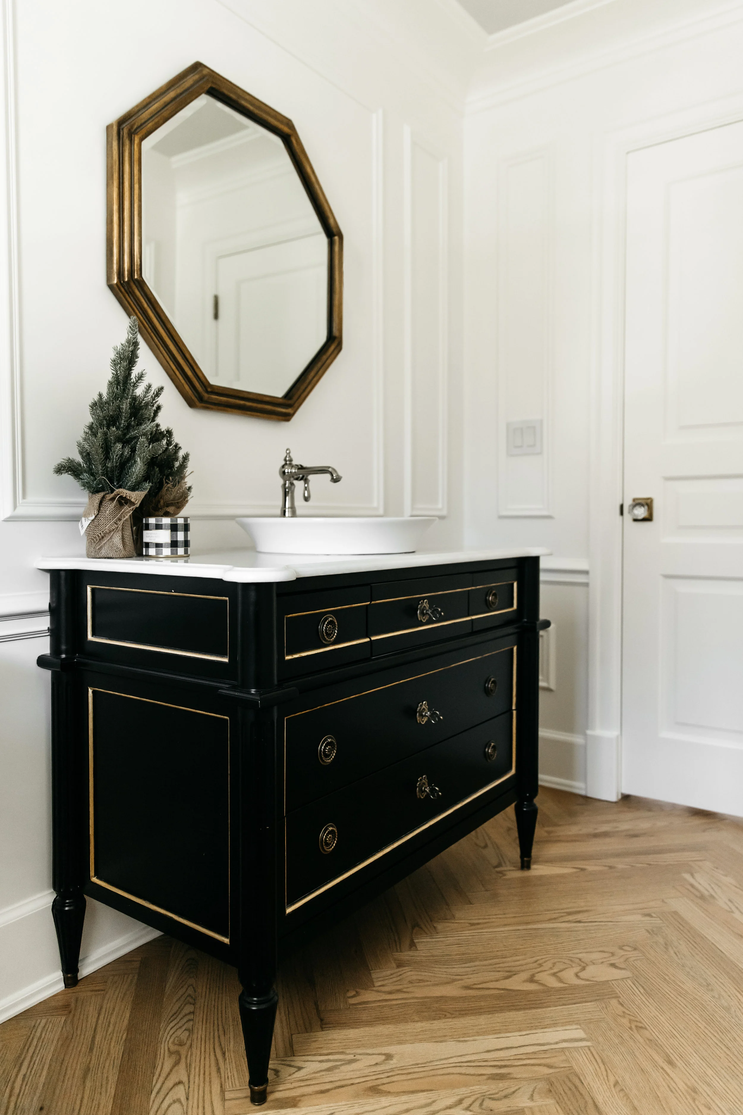 Black bathroom vanity with holiday decor
