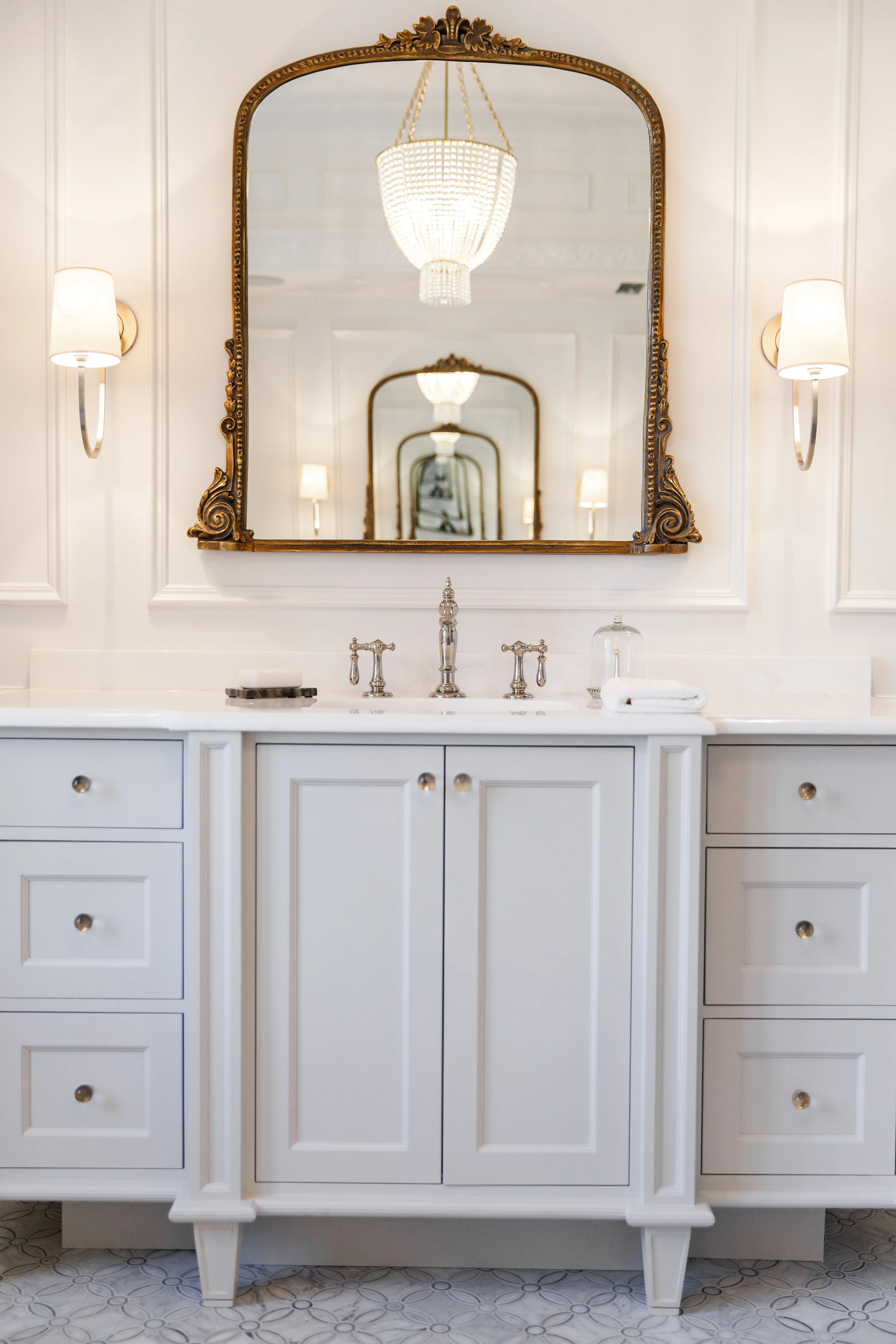 Chrome and brass hardware in master bathroom
