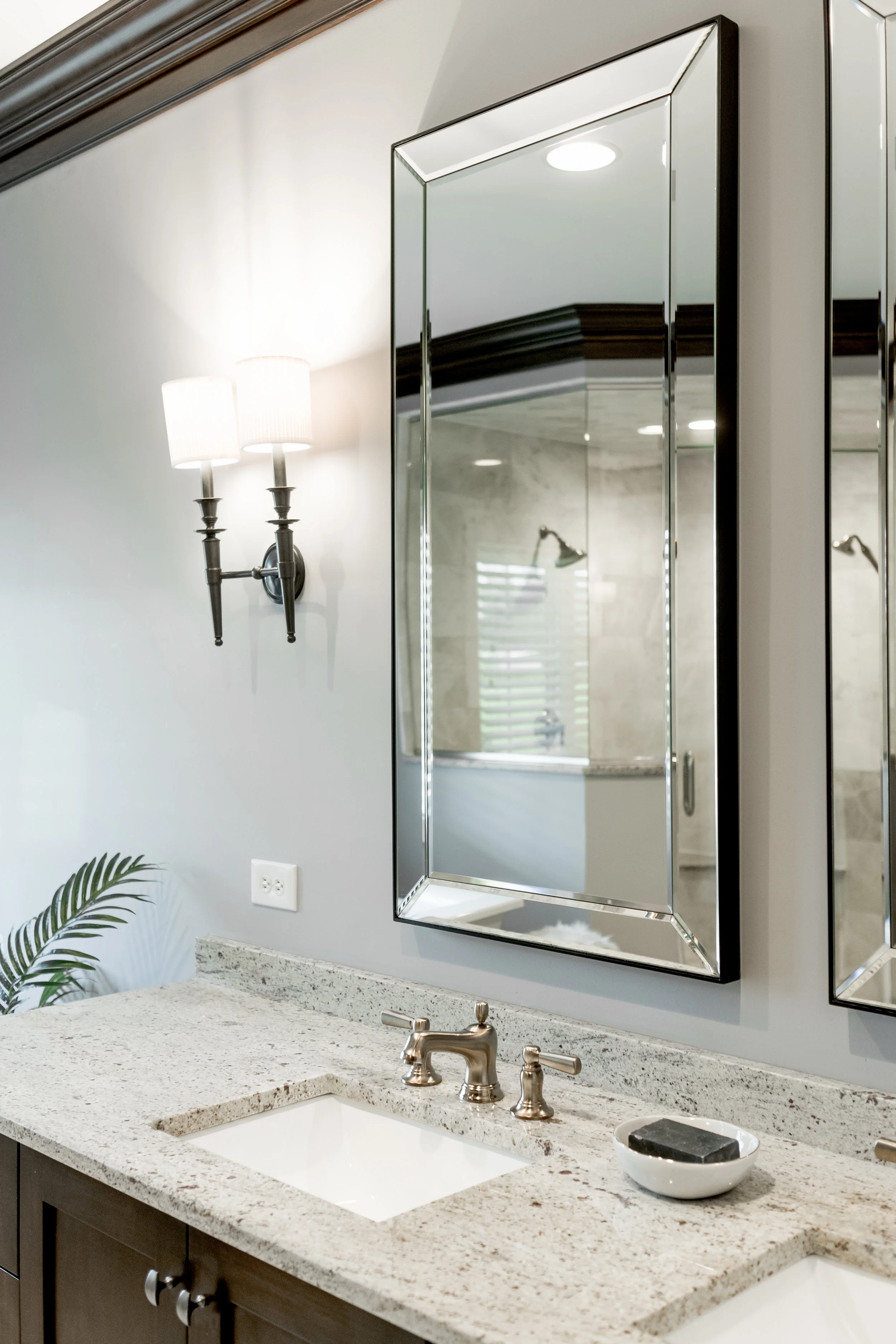 Brushed nickel and matte black hardware in master bathroom