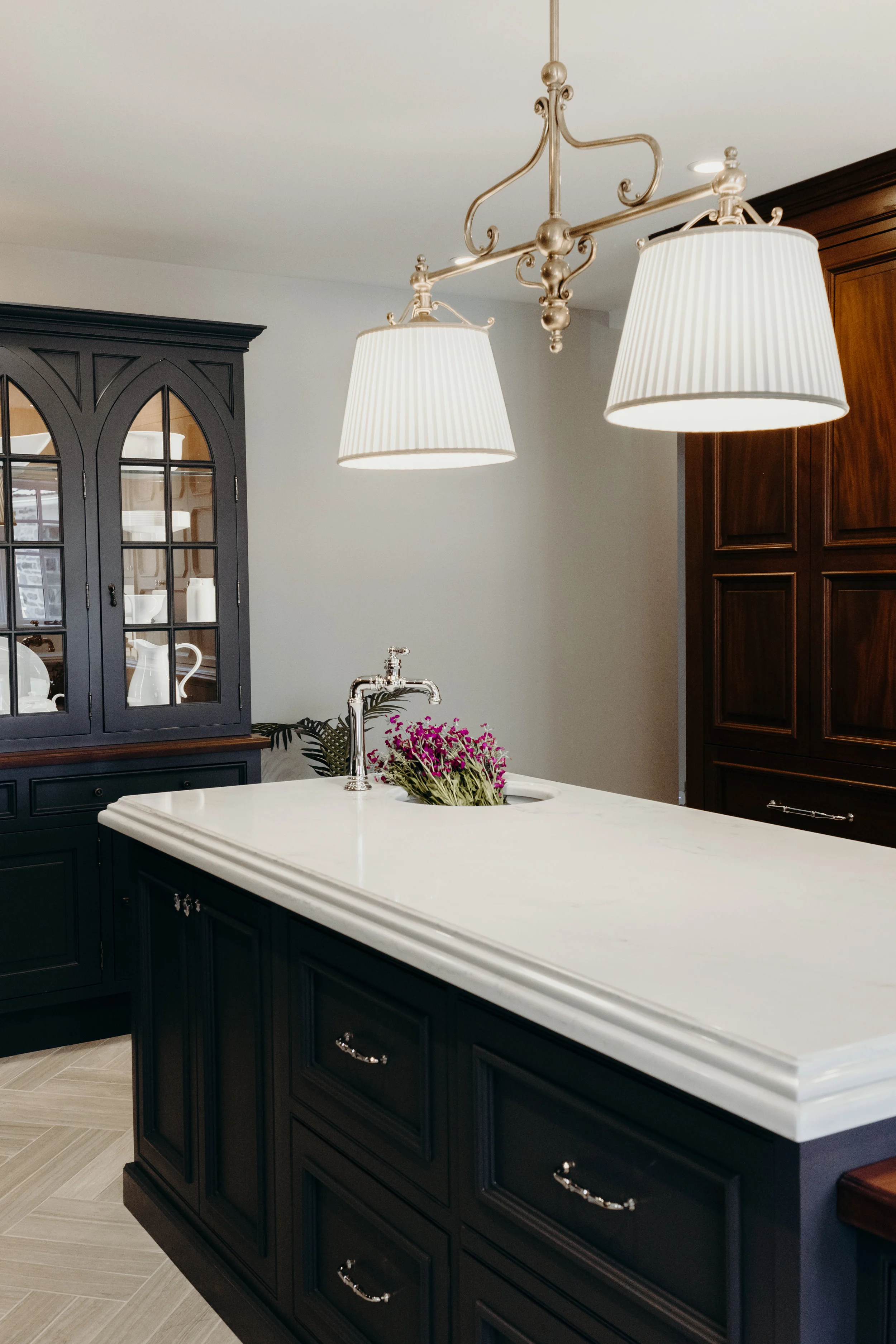 Chrome and brass hardware in kitchen