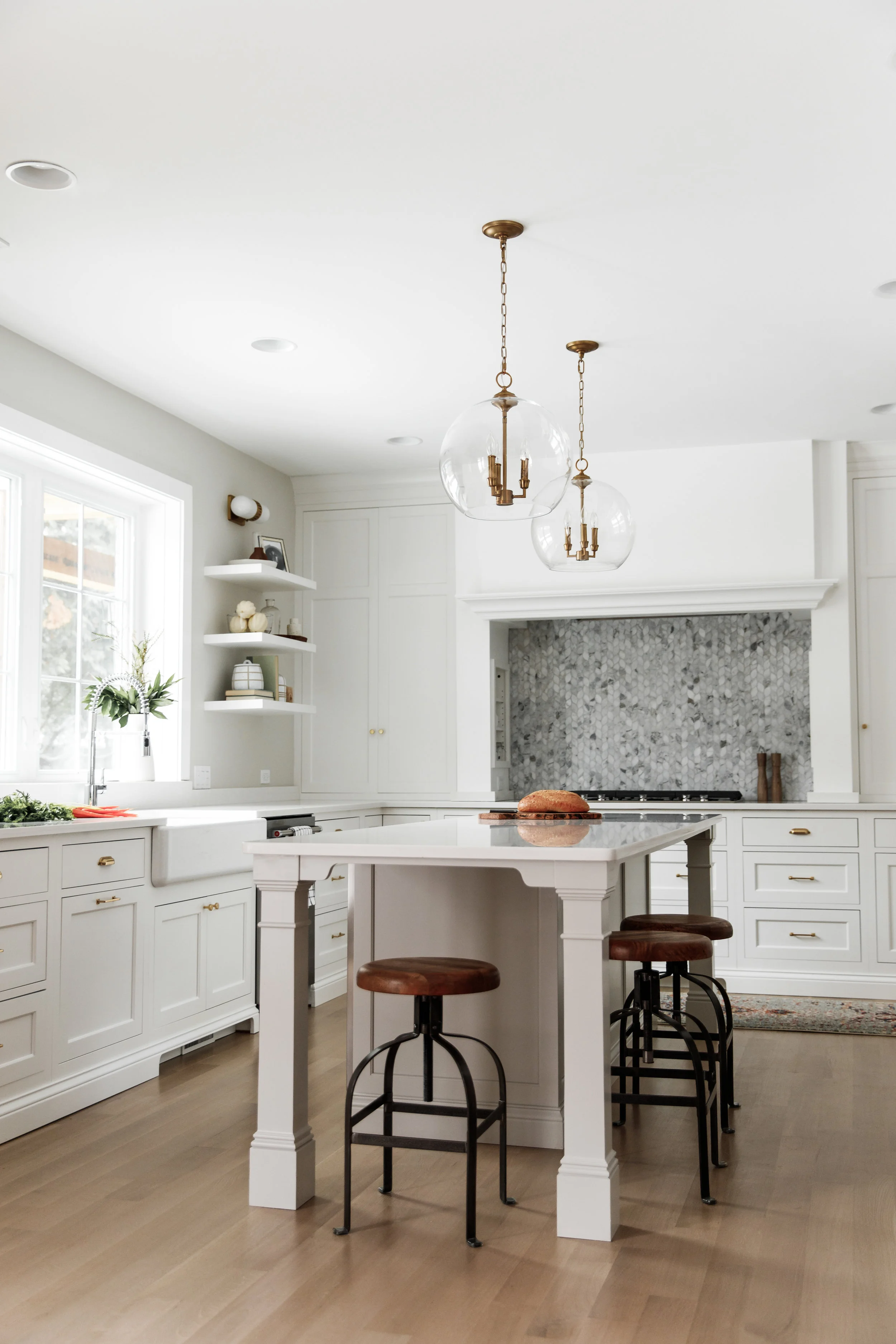 Unique island in white kitchen