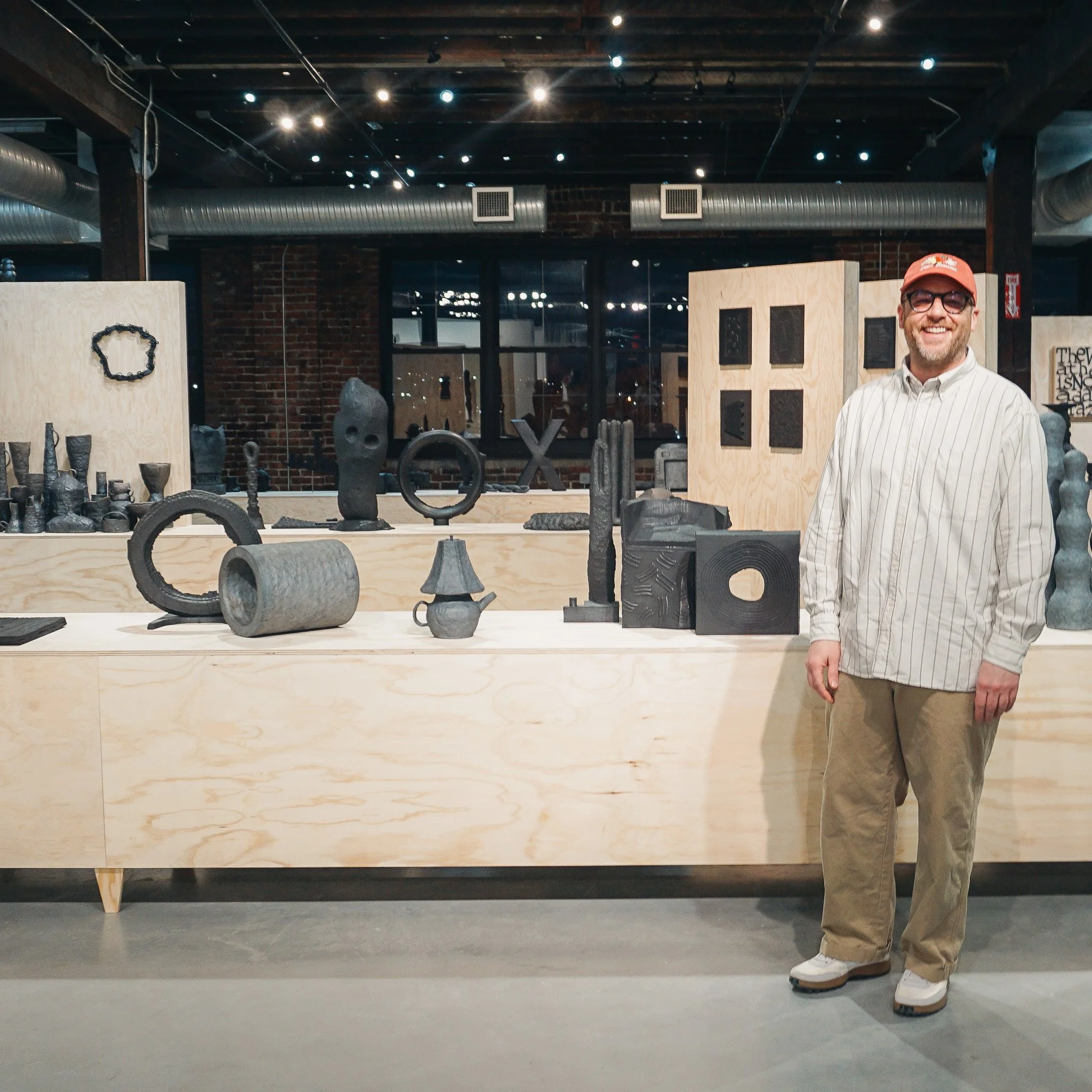 Mathew McConnell in front of installation of "Mathew McConnell: These Things Take Time"