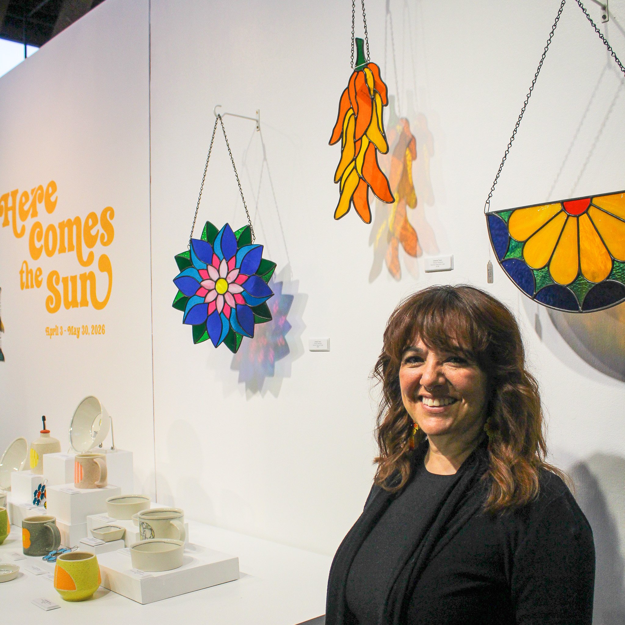 Stained Glass Artist Ursula Tizon with her work featured in "Here Comes the Sun"