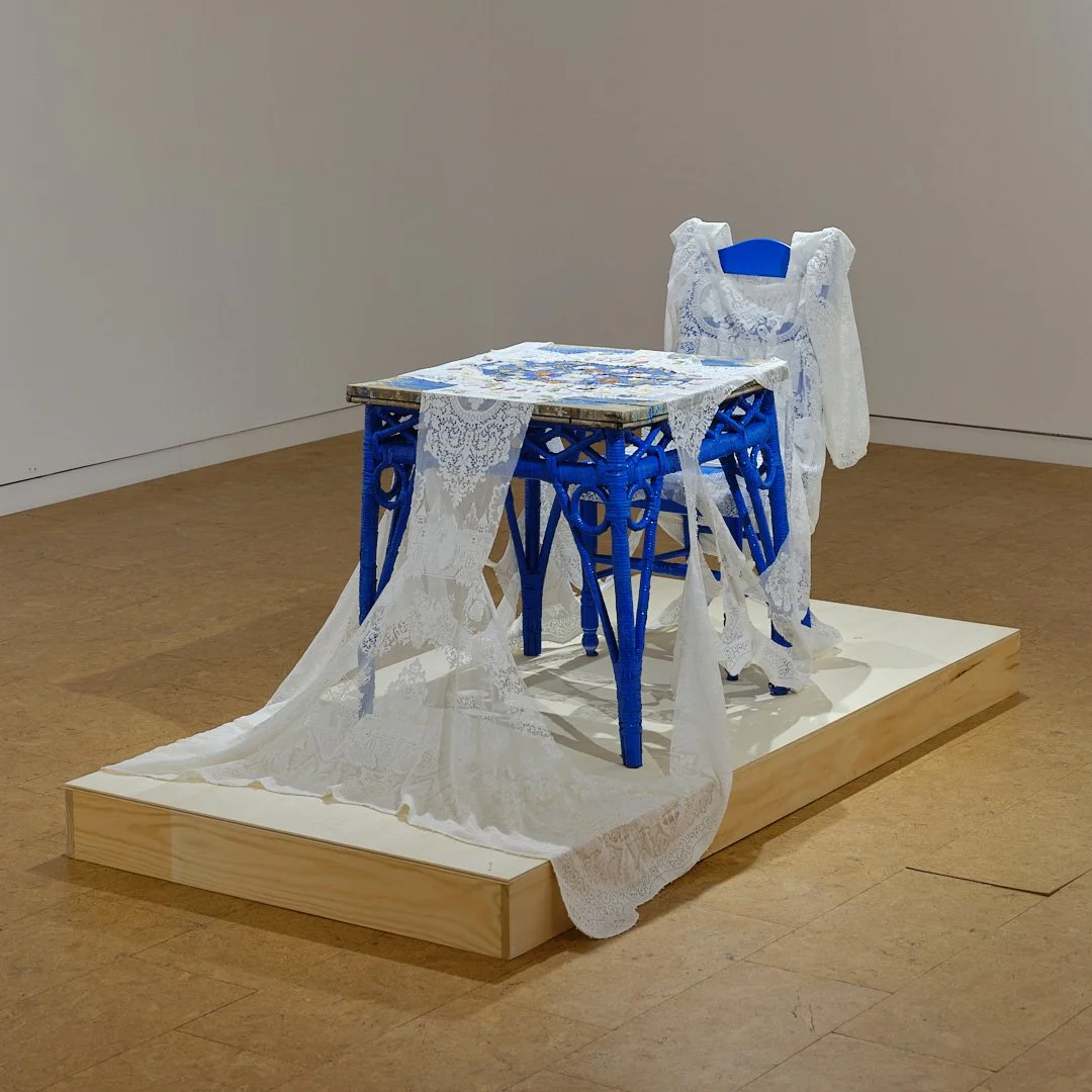Hadley Clark, "Self Portrait, Altar", 2024. Tablecloth (donated), found chair and table, pressed flowers;  36 x 48 x 78 in.
