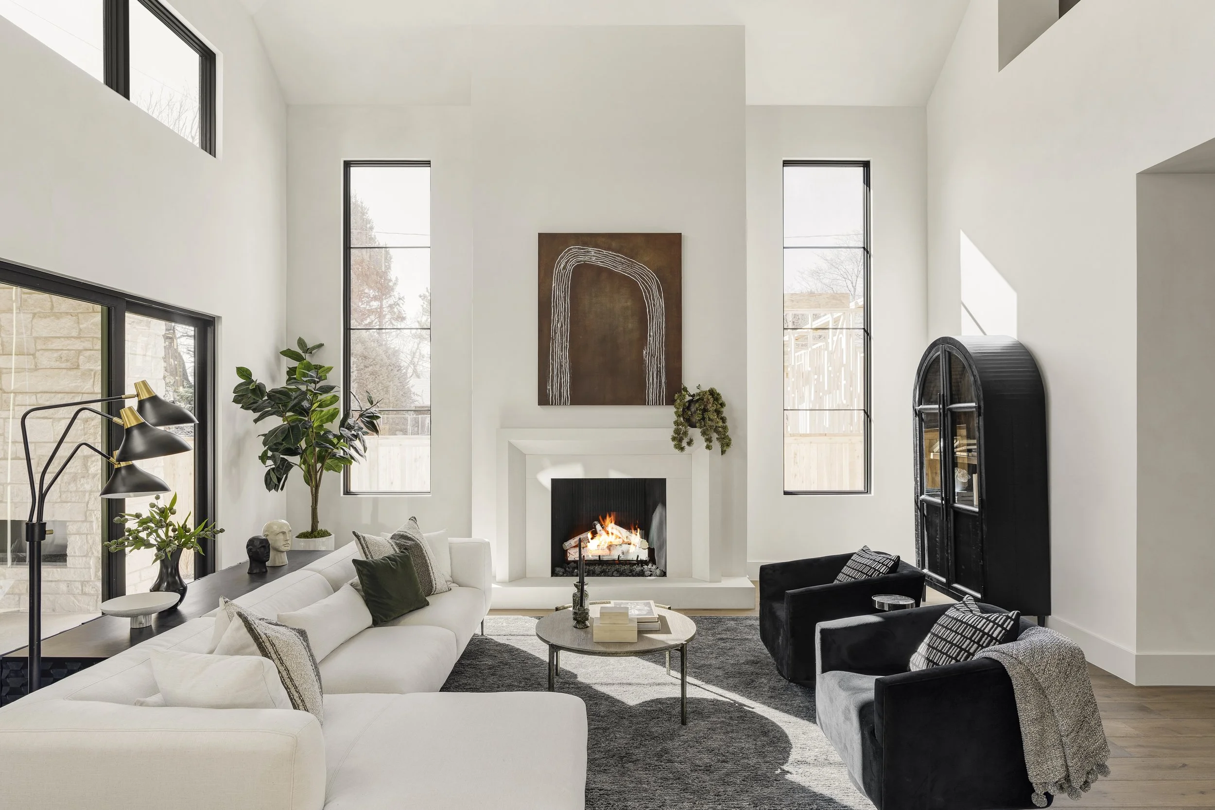 “Luxury home staging in Denver for new construction home by Sarah Noel Interiors featuring modern editorial living room design”