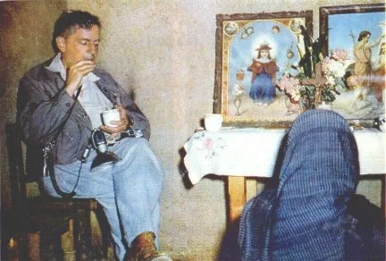 EATING his mushrooms, Wasson takes them from cup holding his night's quota as the curandera prays at the household altar. He chewed them slowly, as is the custom, and his six pair took about a half hour to eat.