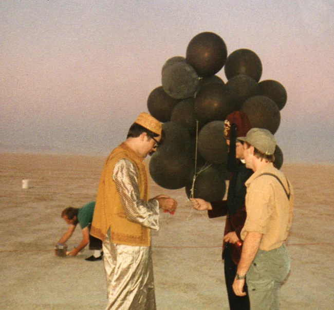 Kimric sends firecrackers to the heavens (with Rev. Al and Little Joe).