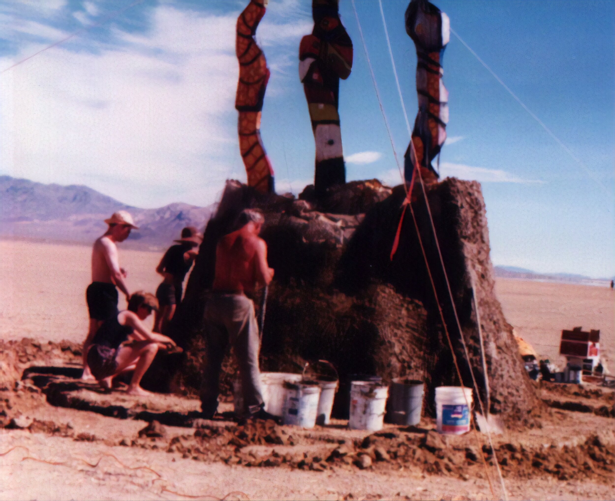  Snakes emerge from the playa. That's Skip the artist in front. I spent several hours helping to coat this with mud. It burned with the Man. 