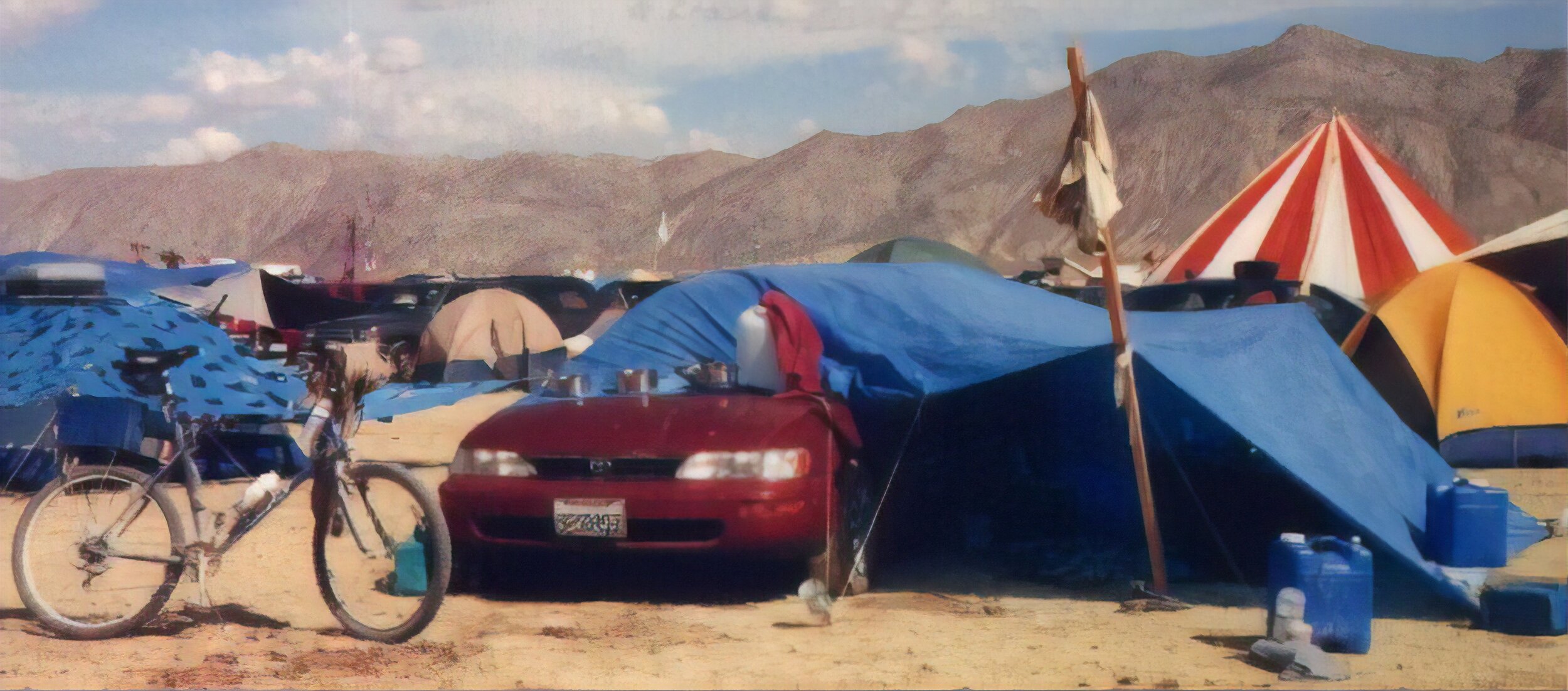  Here is my camp. The two right tires of the car are parked right on the plastic; it's not blowing anywhere. After crawling into my nice new shade shelter I soon noticed something very strange; it felt hotter inside than outside! The thermometer soon