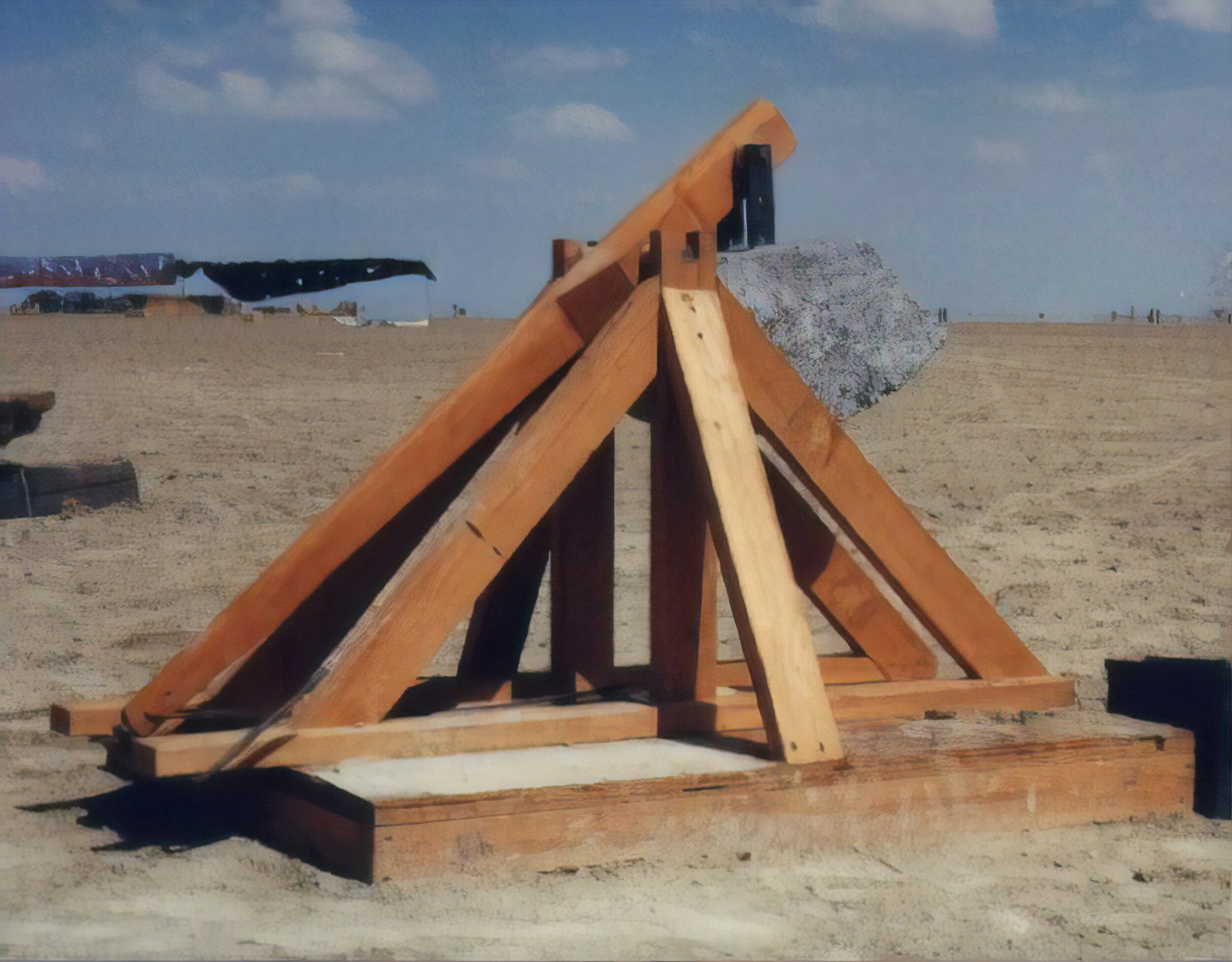  I brought my little  trebuchet  out to the playa. It throws one pound lead balls 145 feet with good accuracy. I thought this would be a semi-original idea but it turned out that there were three bigger ones out there too. It performed very well unti