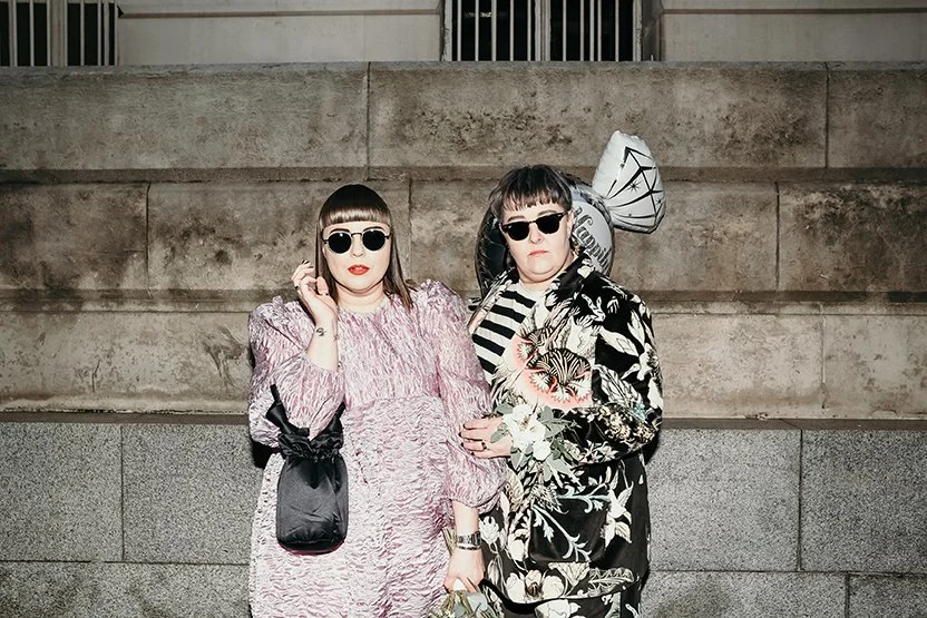 cool female couple in manchester city centre, wedding photography alternative wedding dress