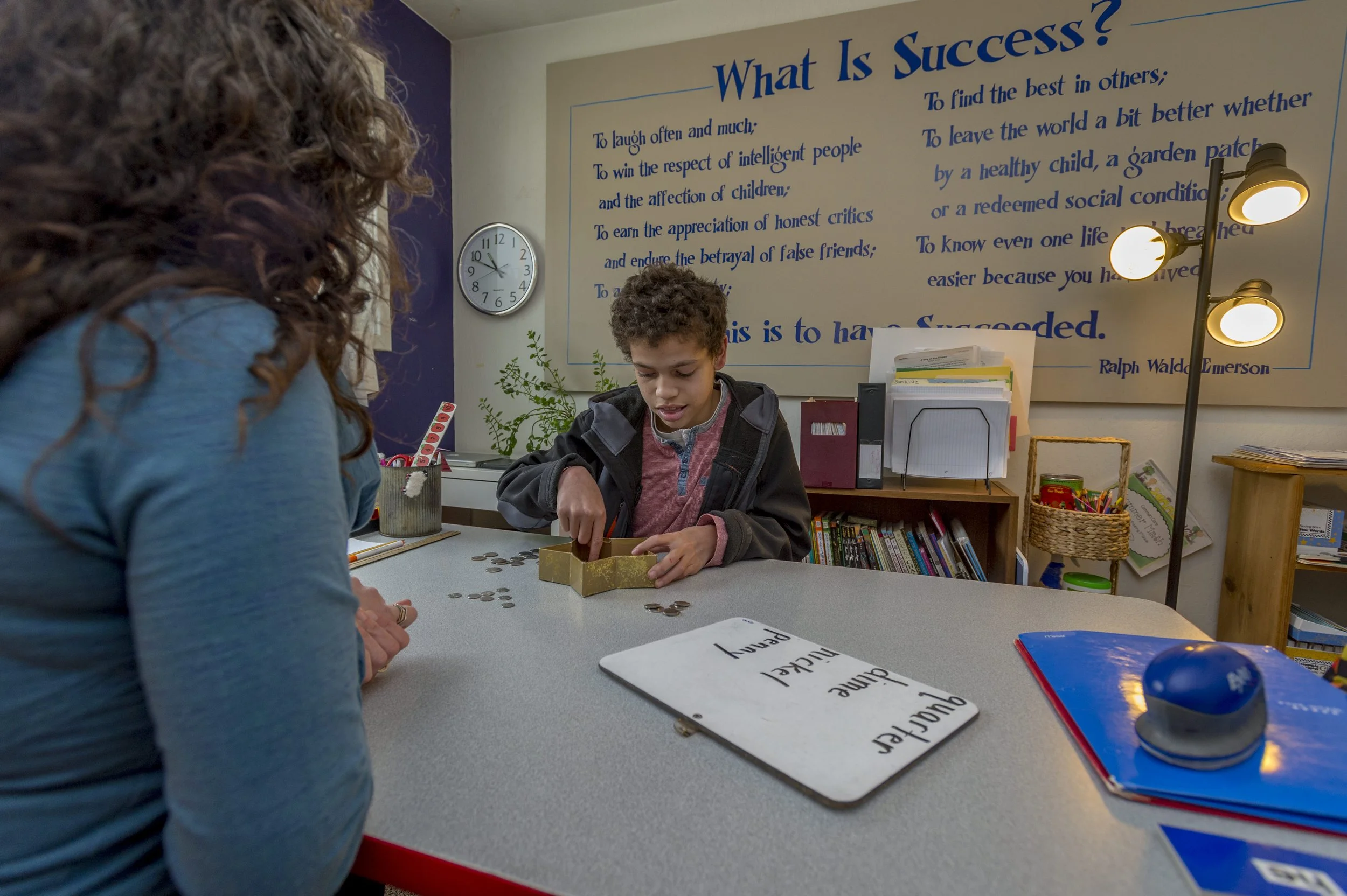 Teacher and child counting money