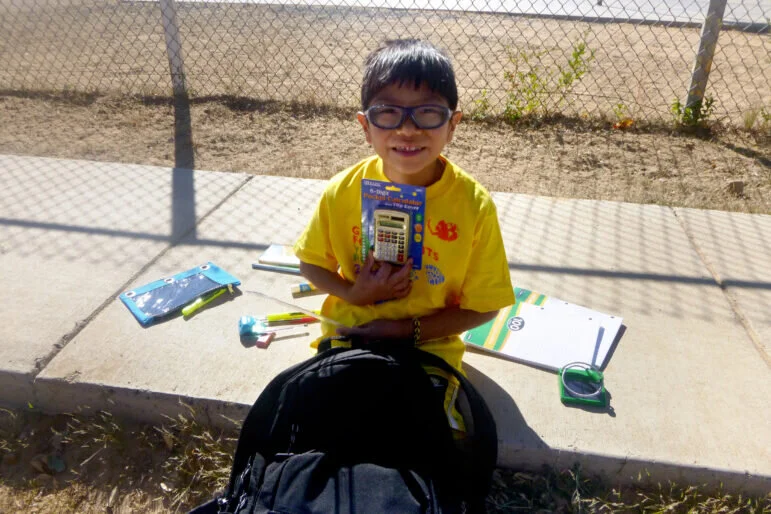 FY15_371_Global_15_15_Kykotsmovi-Hopi-Third-Mesa-boy-with-calculator-771x514.jpg