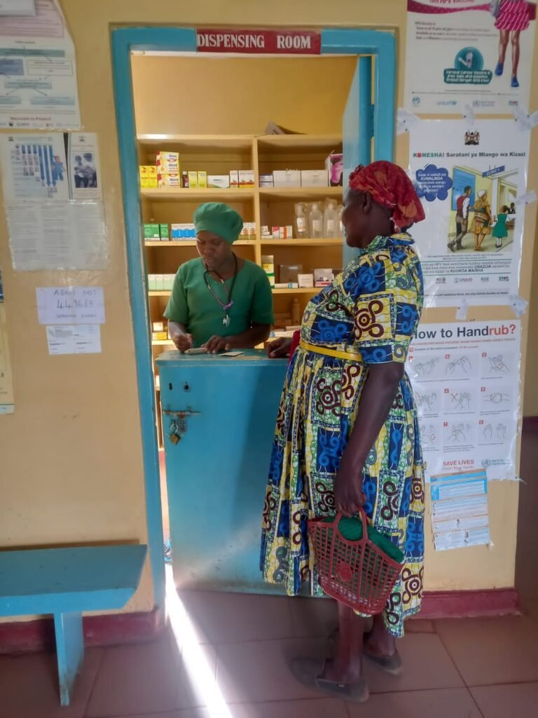 A-woman-picks-up-her-prescription-at-the-dispensing-room-woman-at-the-Kebeneti-Clinic-768x1024.jpg
