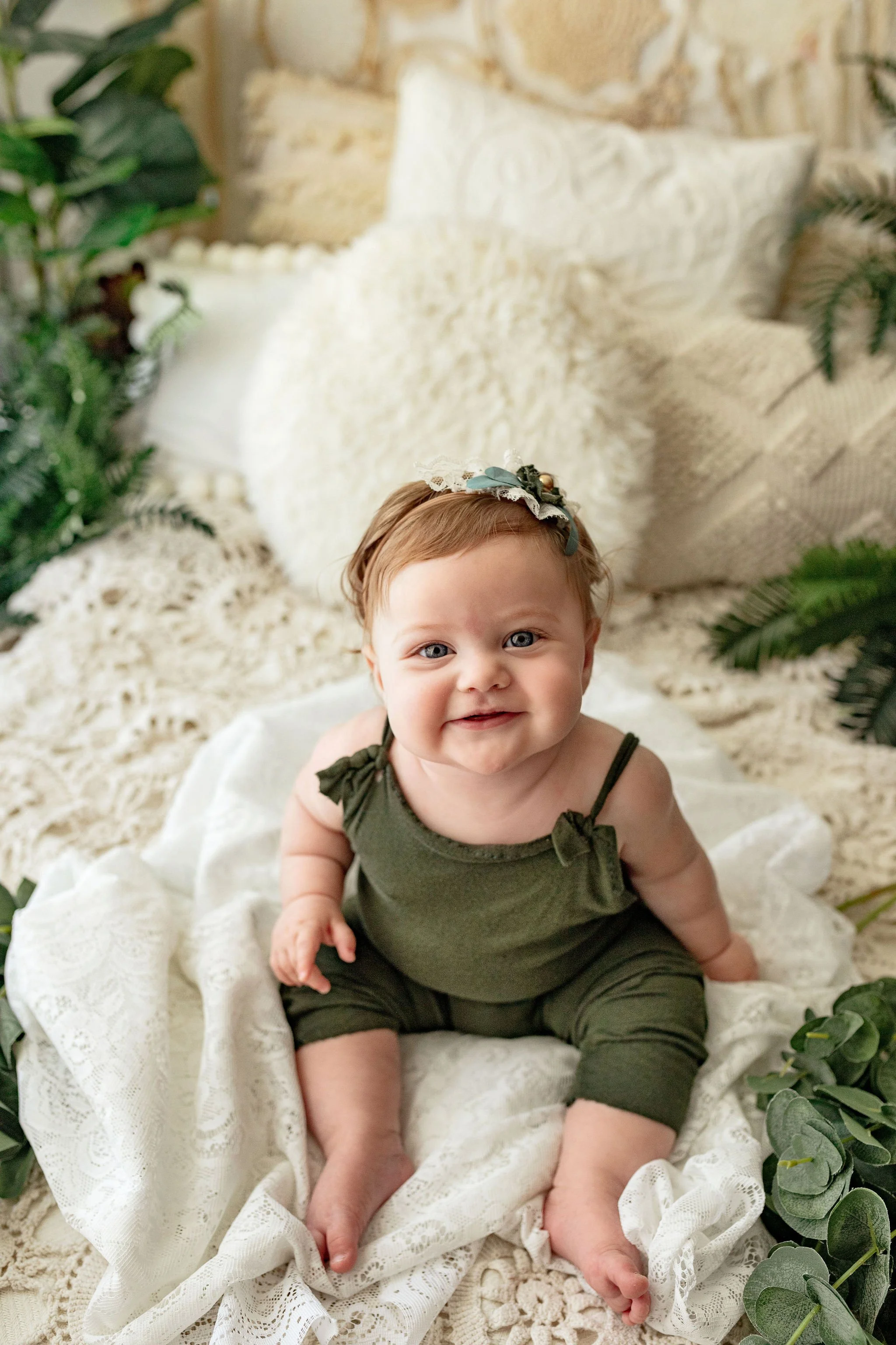 9 month old milestone photo shoot with best family photographer in Nocatee photo studio with boho set up and vintage lace with earth tone clothing