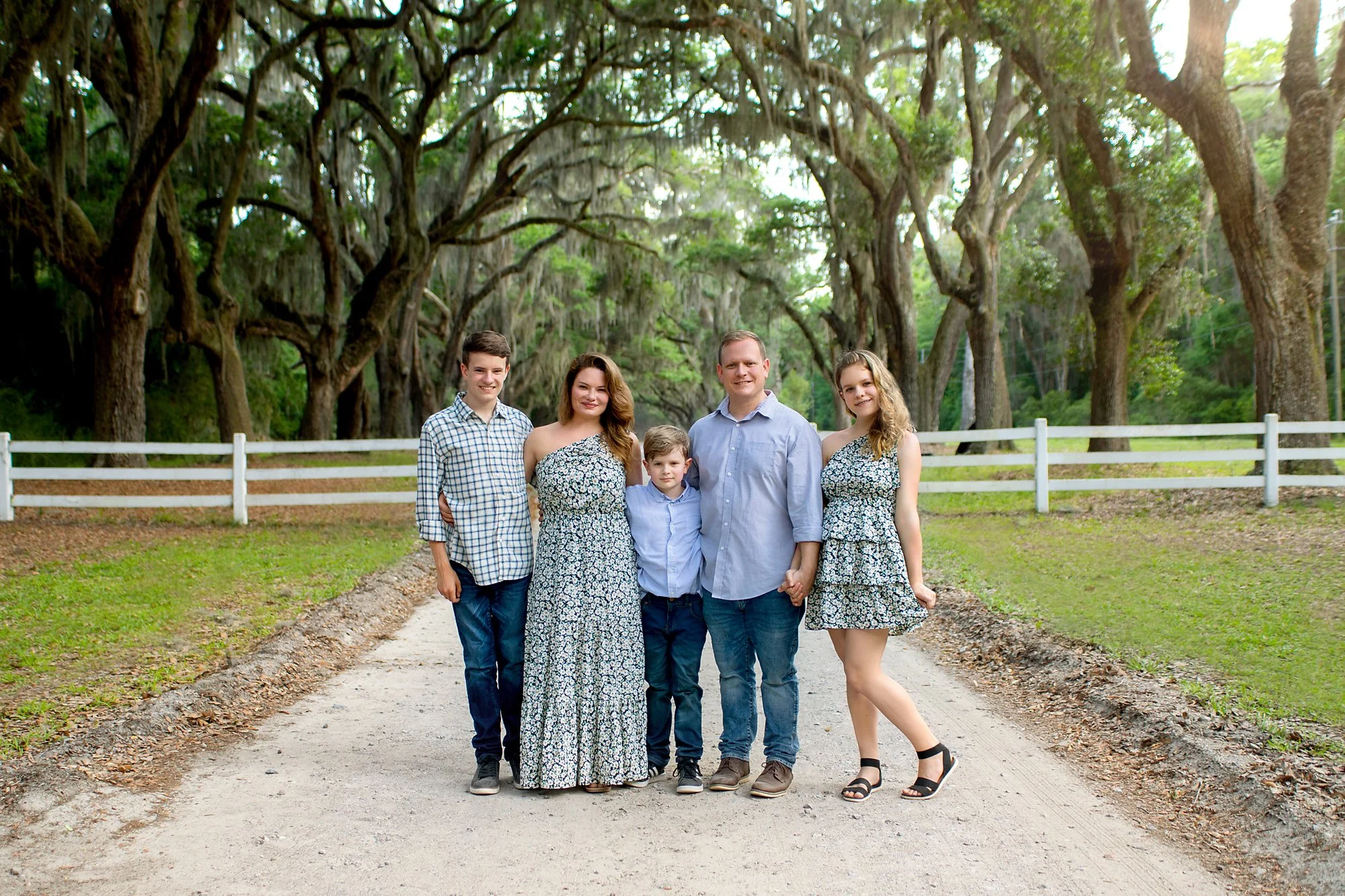 Family pictures at Magnolia Ave in downtown St. Augustine, FL during summer time with best photographer and everyone wearing earth tone clothes for their photo shoot
