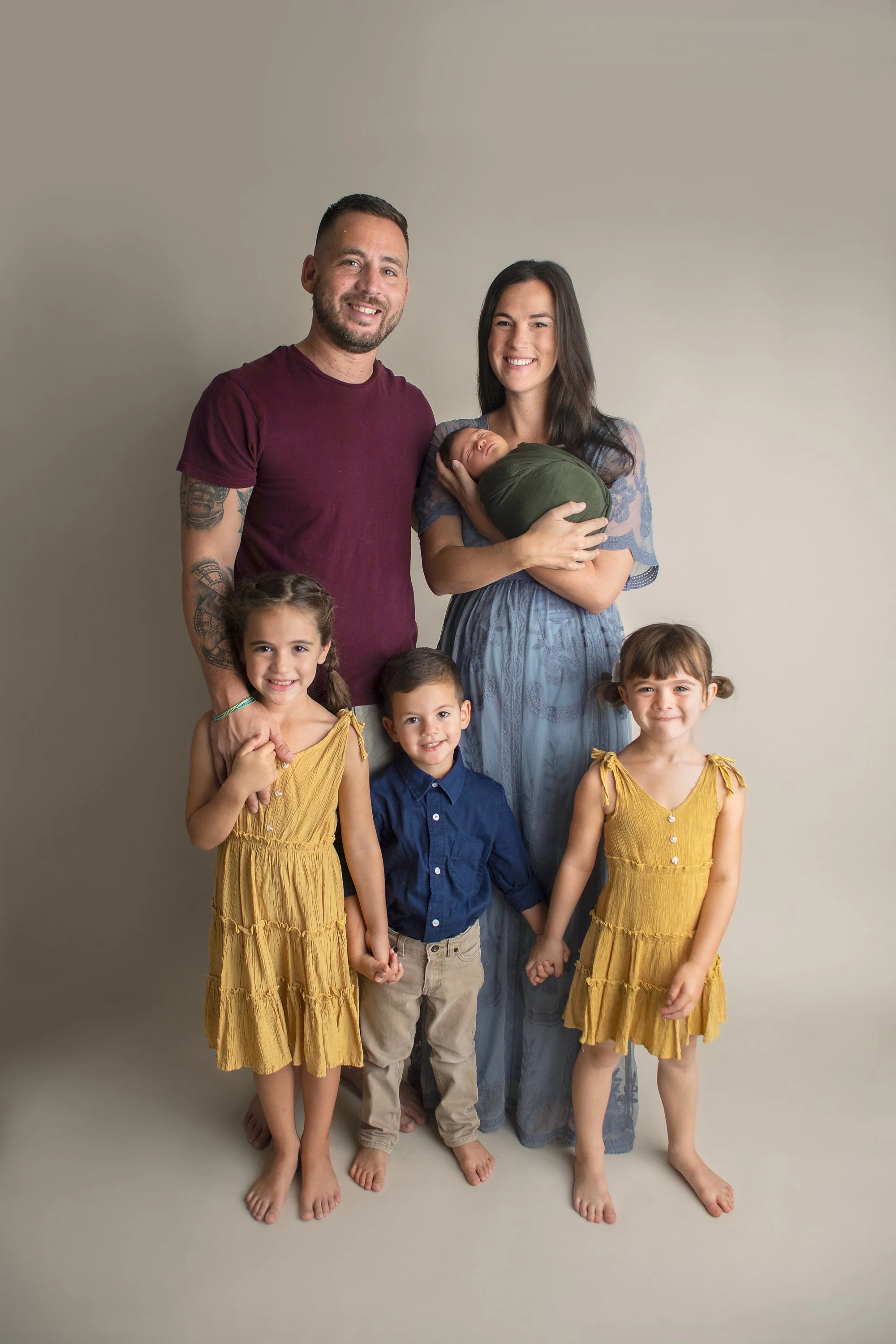 Family photos for newborn baby boy in Ponte Vedra at photography studio on neutral backdrop