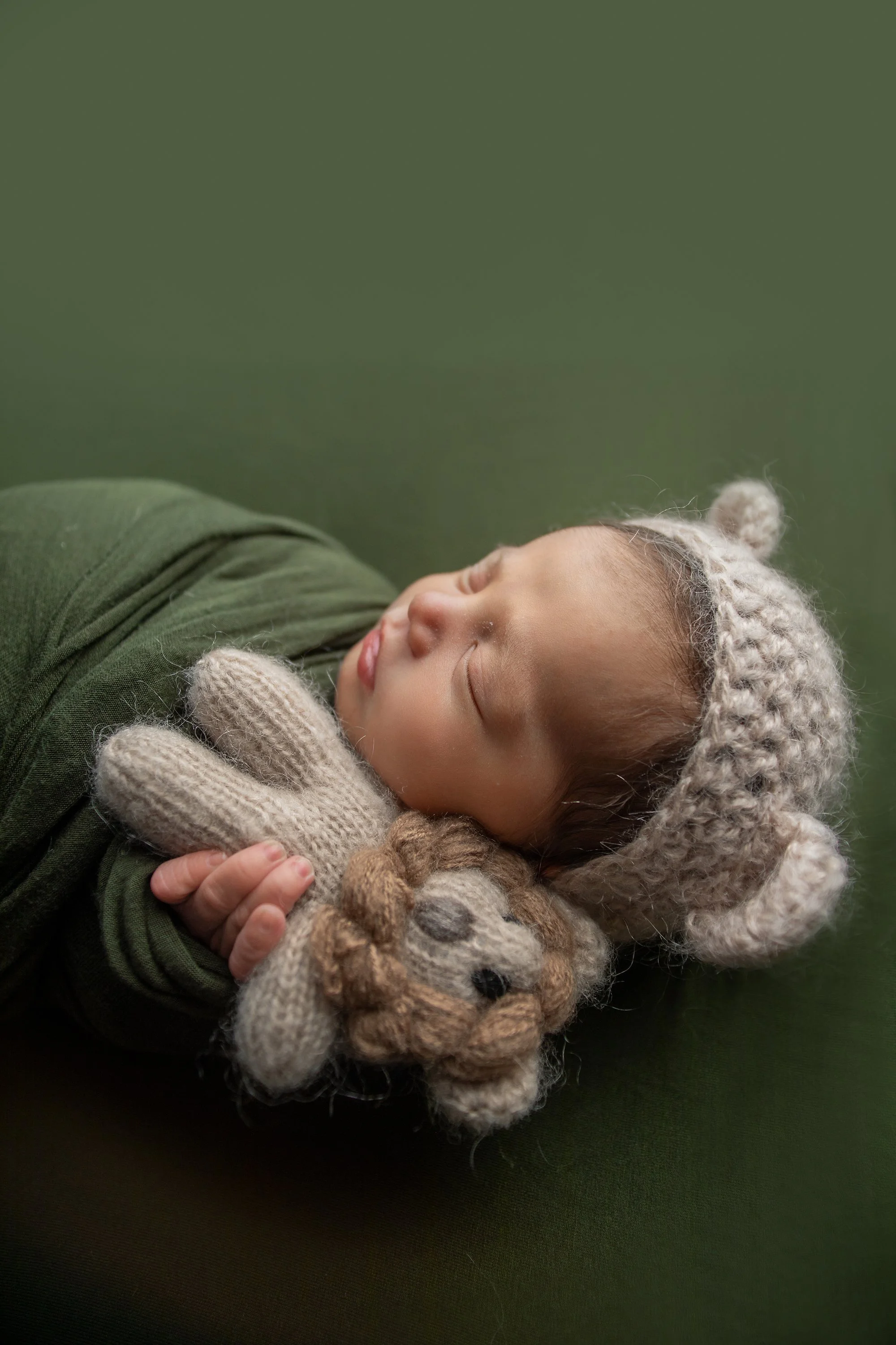 Baby boy photo shoot with olive green, boutique lion prop stuffy with lion newborn bonnet in Ponte Vedra