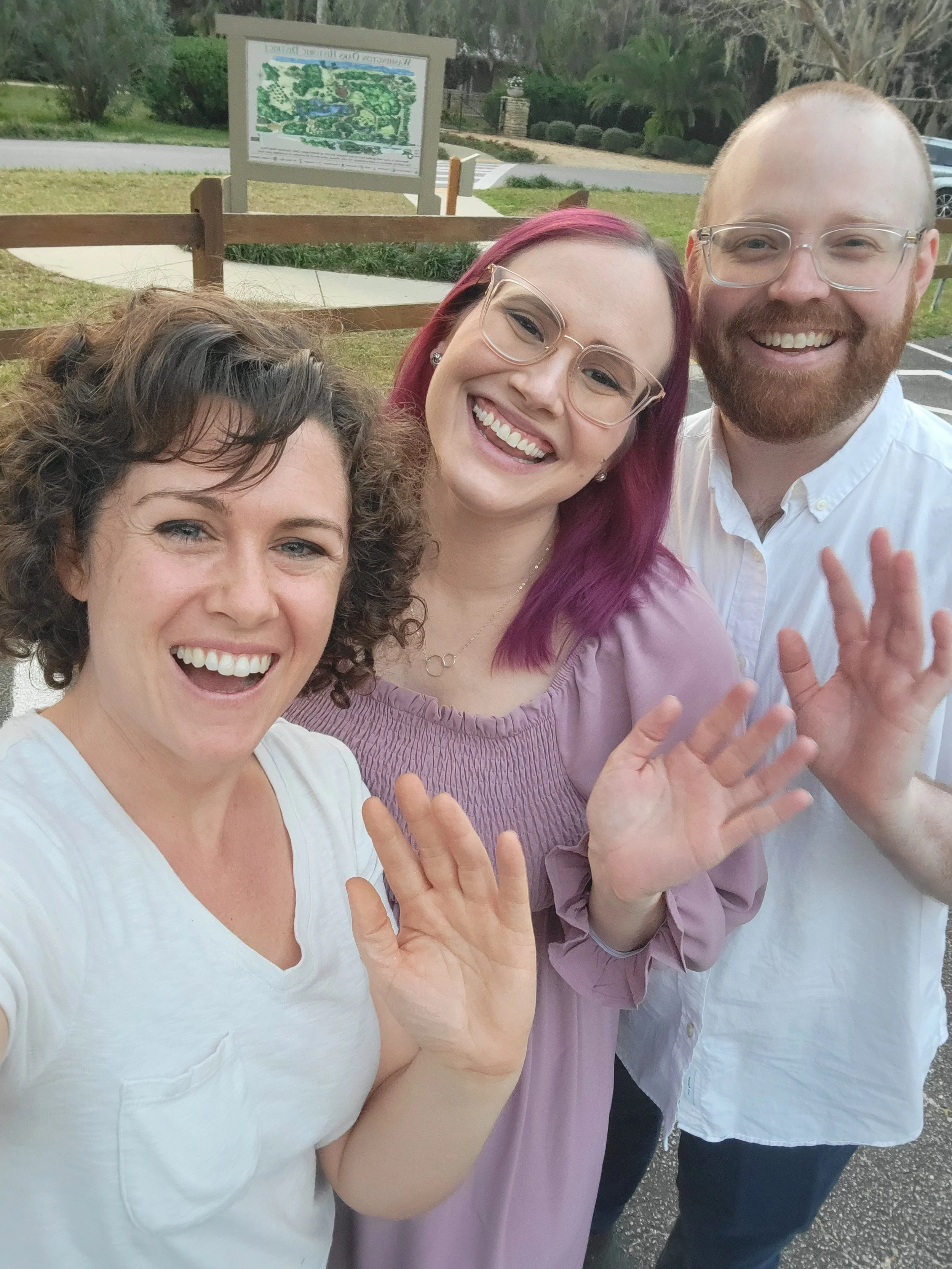 Jacksonville family photography at the beach during sunset with dunes and greenery and parents in pastel clothes.
