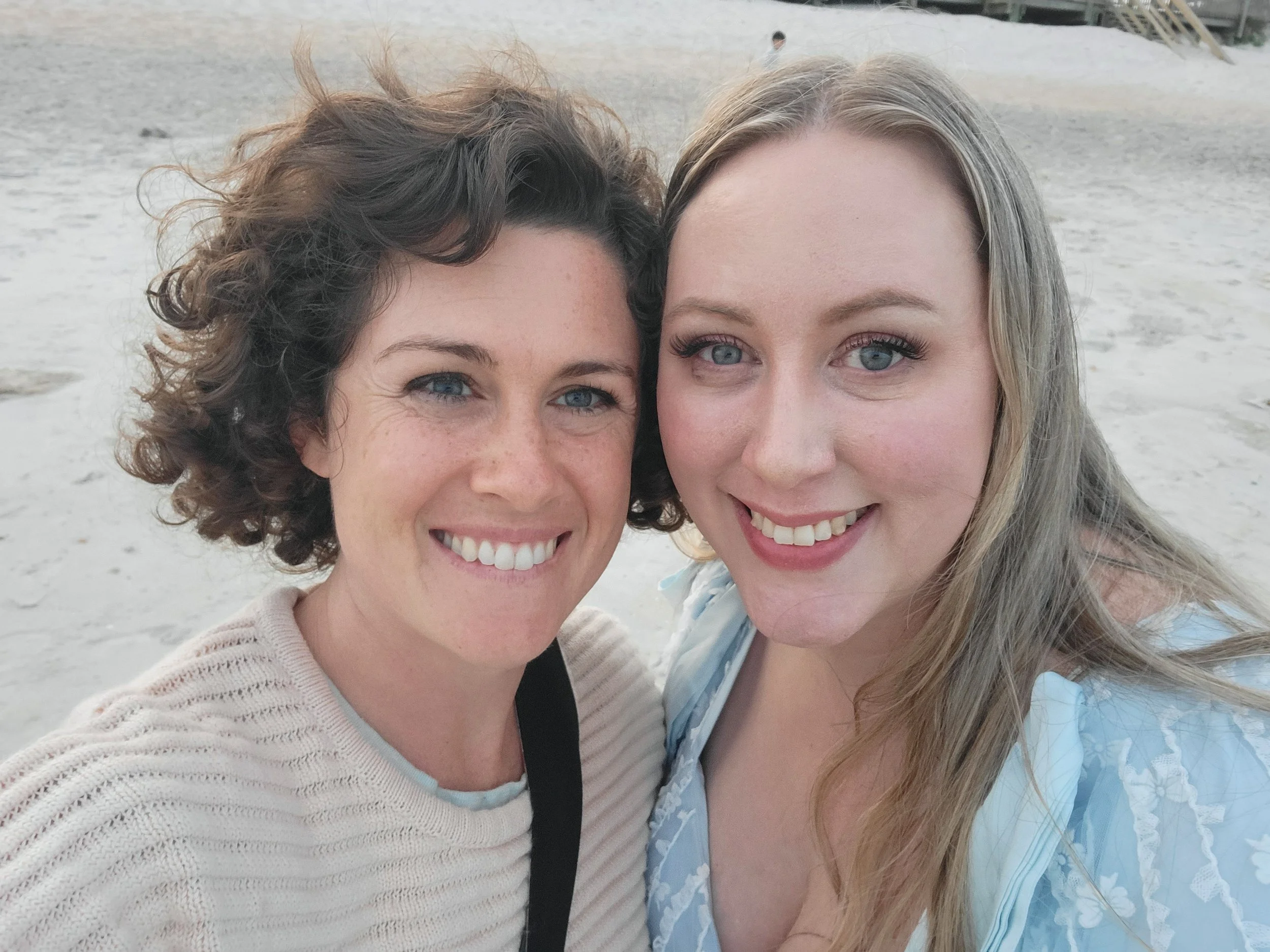 Luxury St. Augustine FL photographer during family photo shoot at the beach during golden hour with natural light and sunset.
