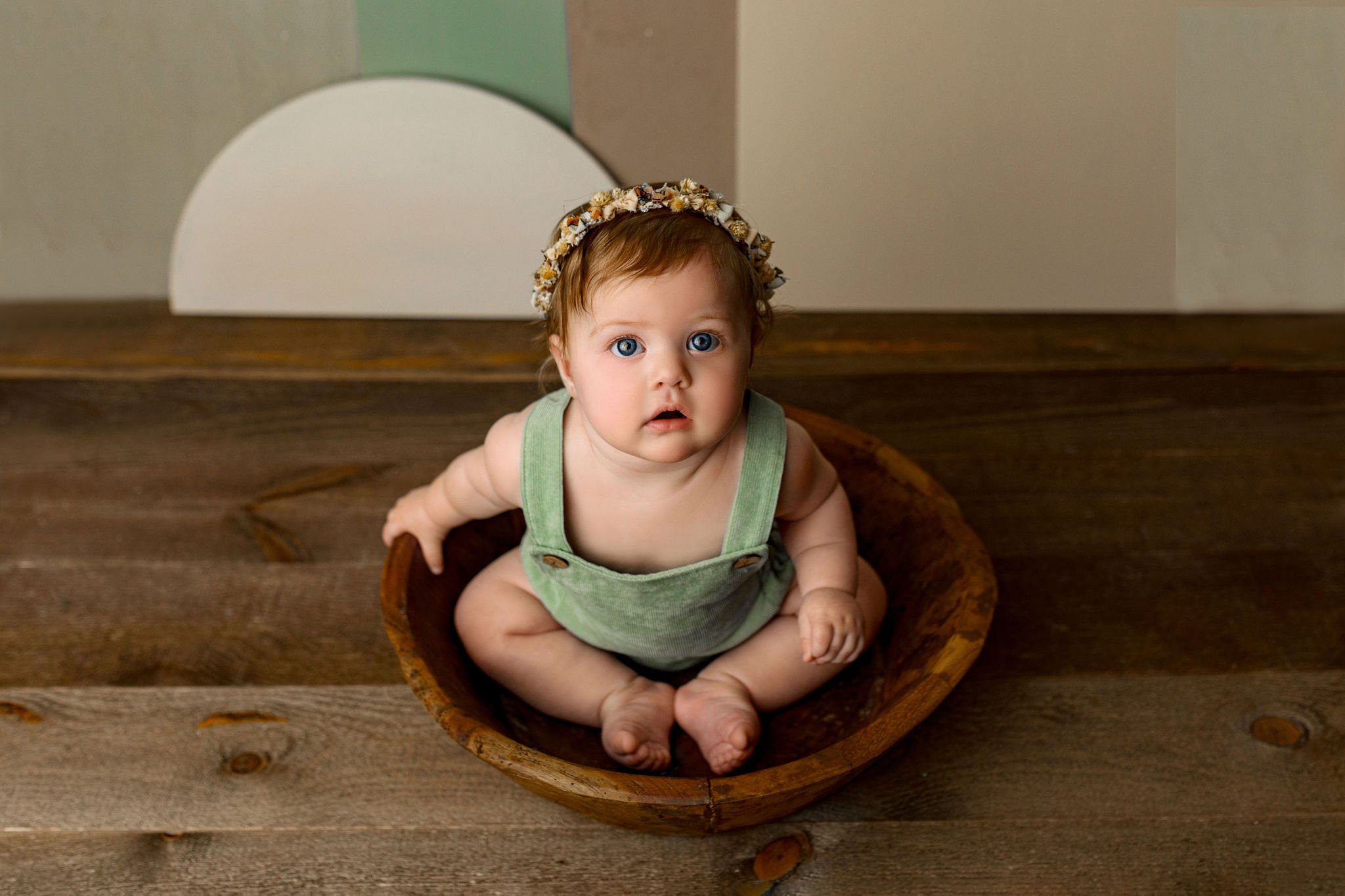 Luxury one year old photo shoot with family pictures and best photographer in World Golf Village FL with wooden floor and vintage boho props
