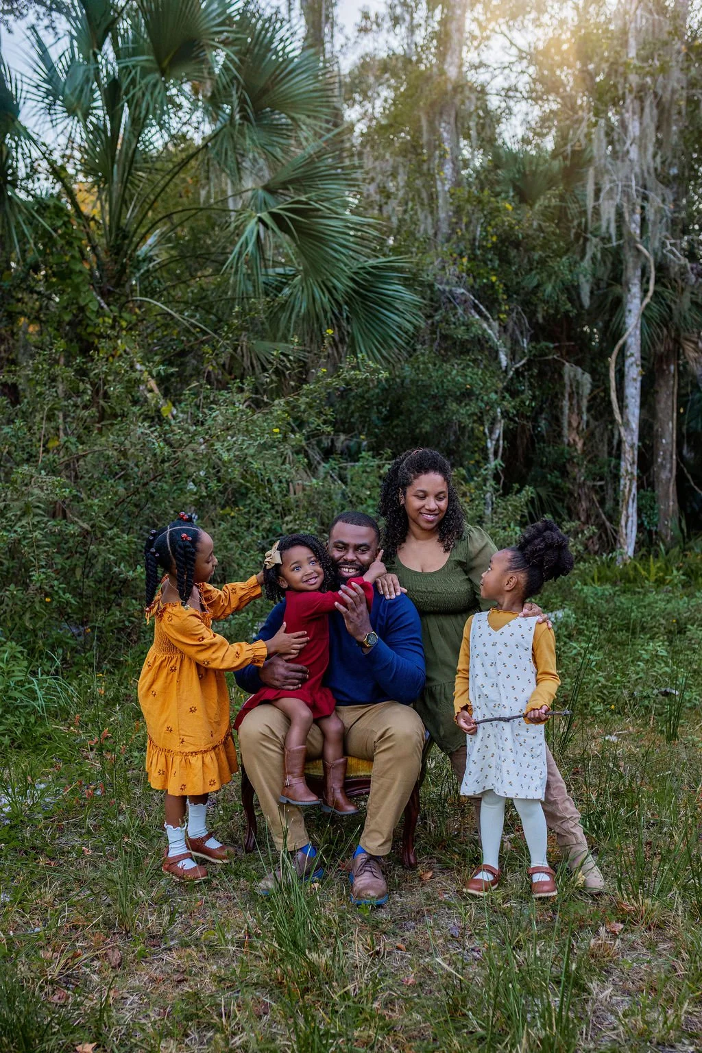 Family photo session with african american parents and kids at national park near Jacksonville FL with natural light photographer and luxury outfits in earth tones included from client wardrobe