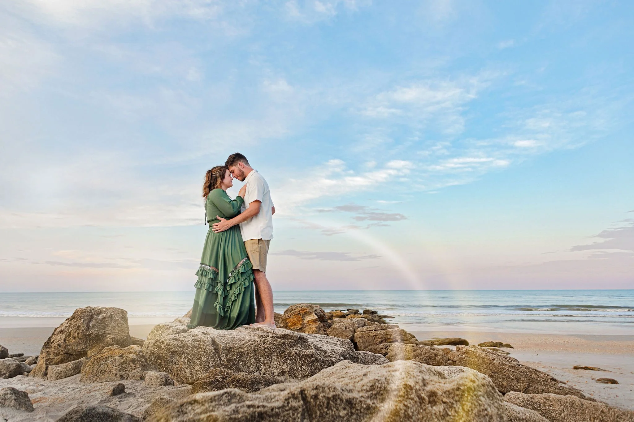 Beach photo shoot in JAX florida with natural light at sunset in the ocean with couple on vacation for reunion 