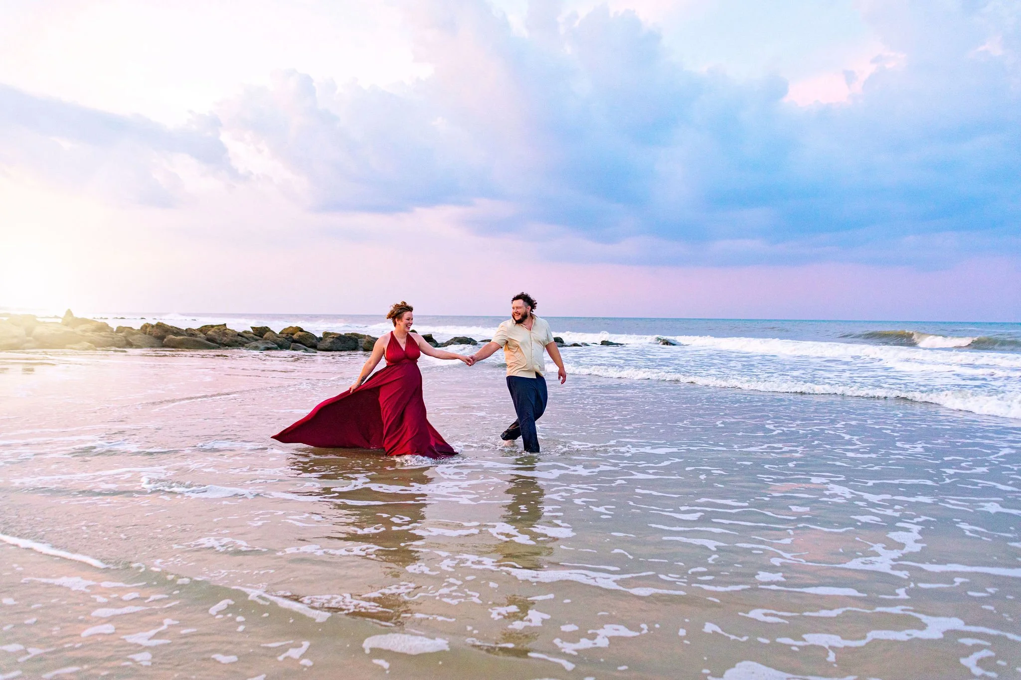 Beach maternity photo session with modern maternity photographer in Jacksonville Beach, FL with high end style and clothing 32250