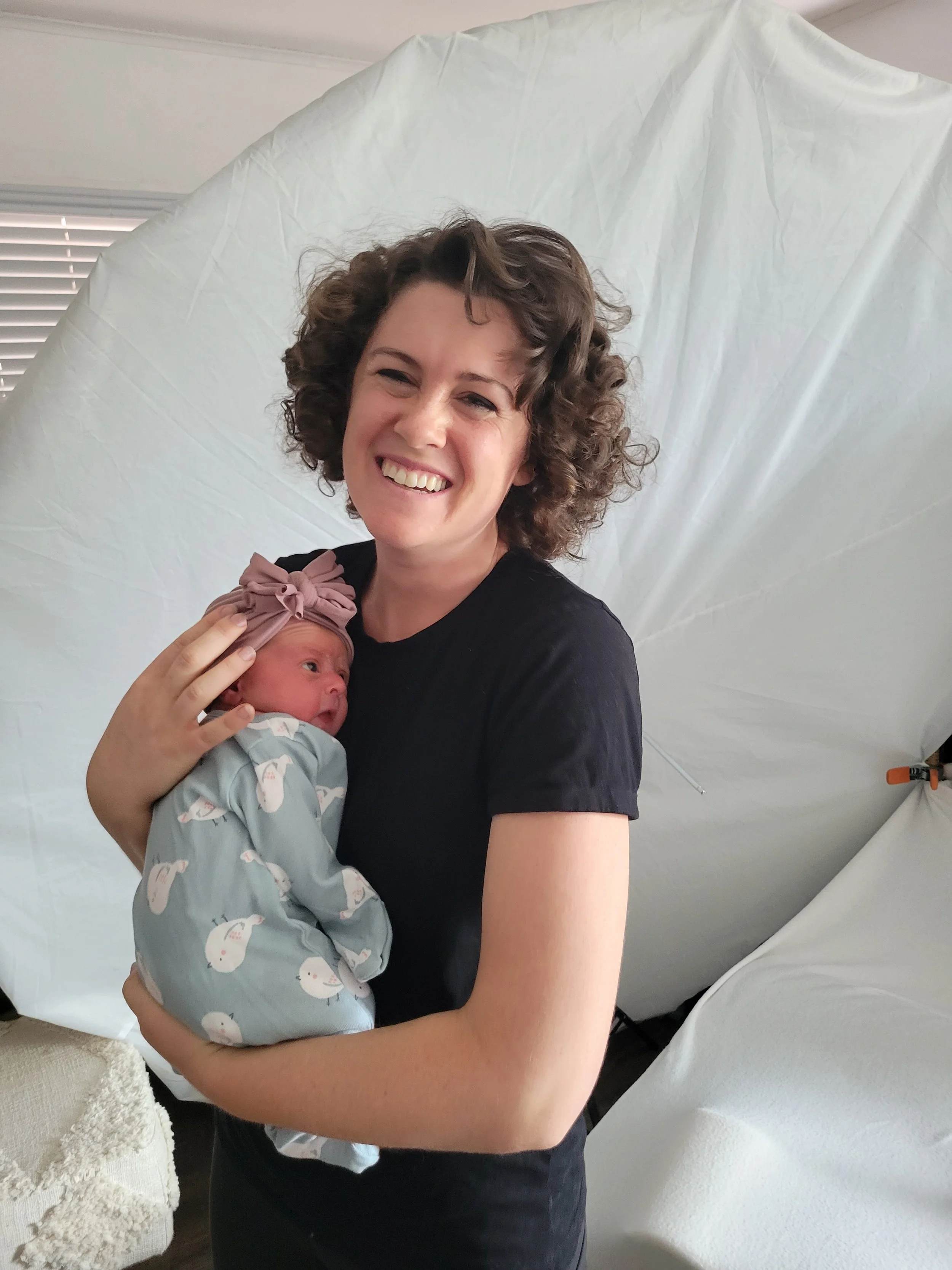 Safe, educated, luxury newborn photographer in photography studio located in St. Augustine FL.