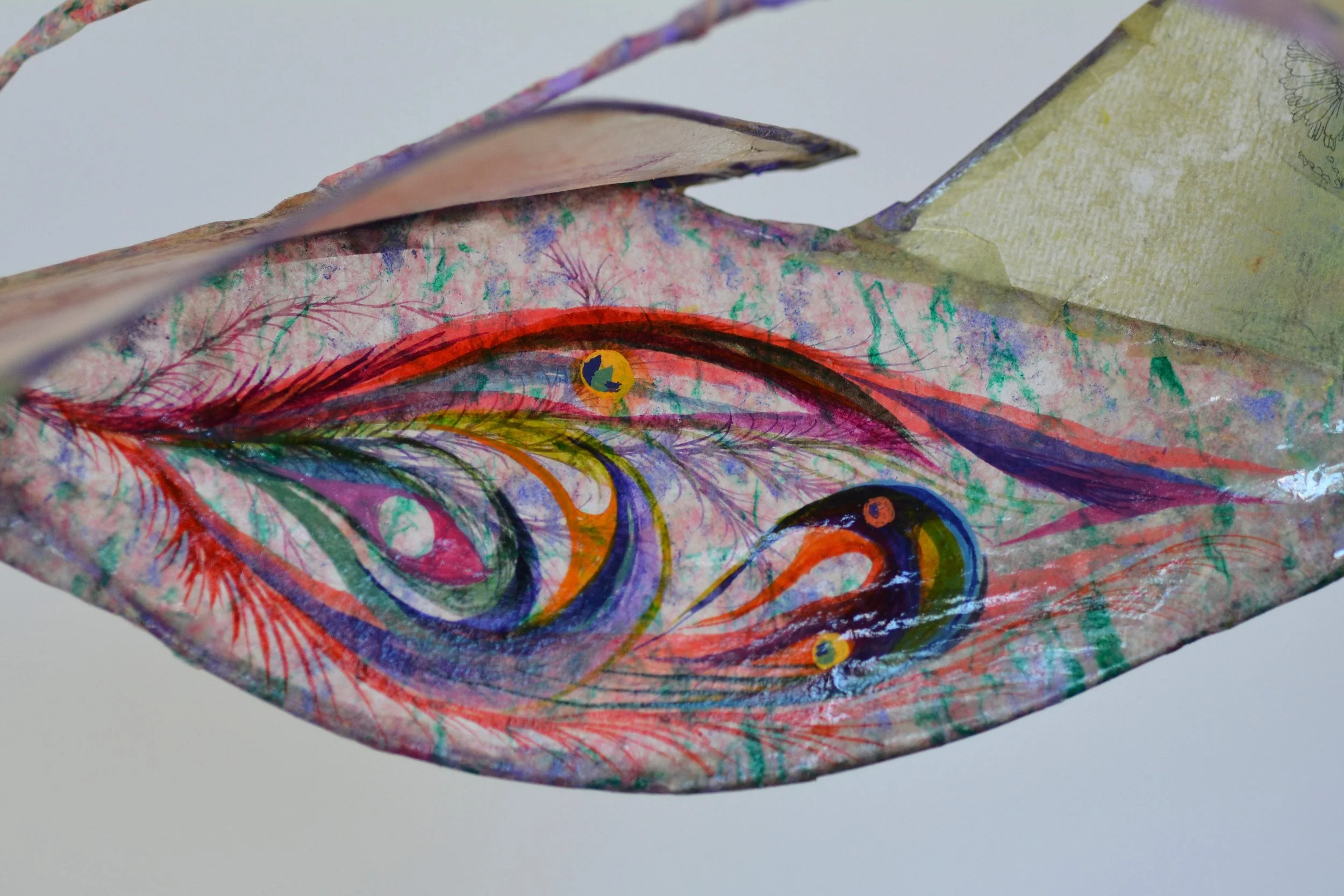 detail of sculpture, abstracted eye and floral shapes