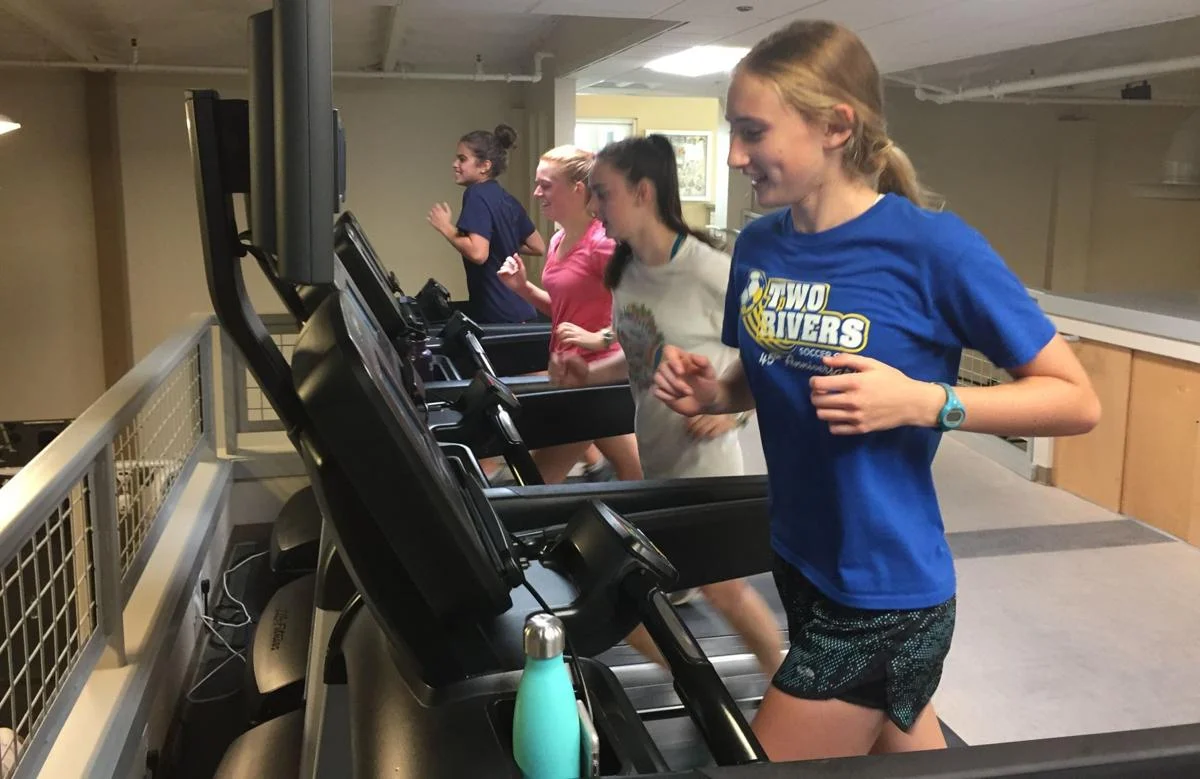 Working out at HealthQuest Fitness Center on Friday are Napa High cross country runners, foreground to rear, Molly McGrath, Jane McLoughlin, Emma Sarazin and Heidi Hirsohn.
