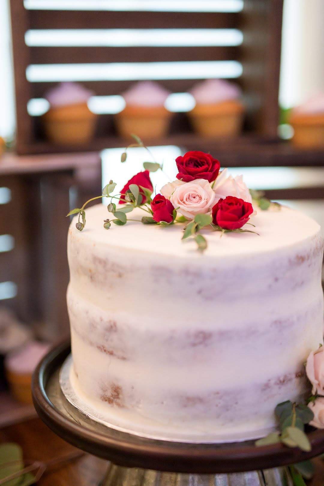 Naked wedding cake with fresh flowers.jpg