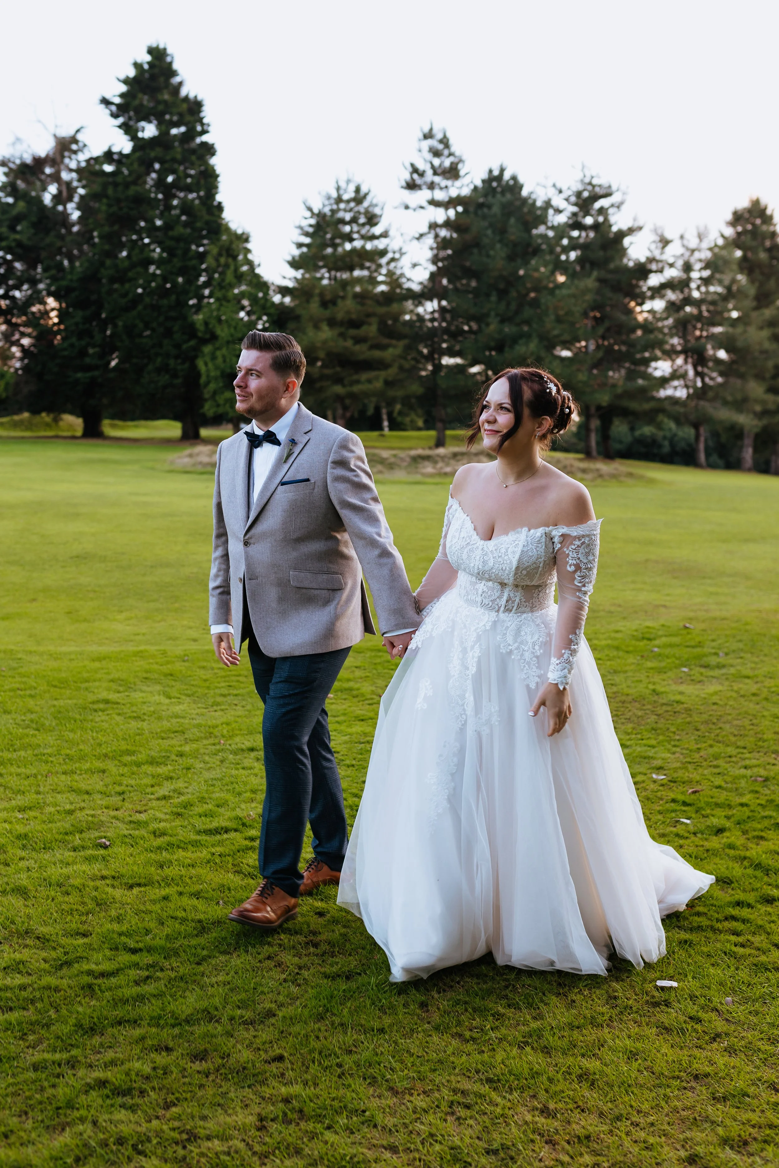 sussex wedding venue bride and groom walking wedding photographer