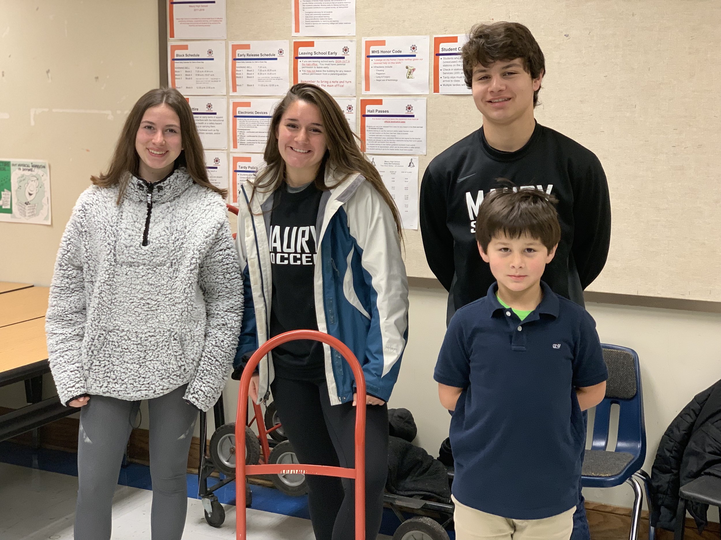 Representatives from the Girls and Boys Soccer teams, and Grayson Moody, helping with the Saturday 8 am shift. Thanks for waking up early during the weekend to help!!