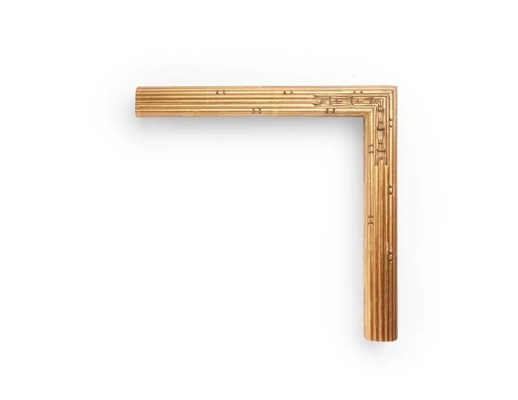 Chiseled Empire An American 1-1/2 inch Empire-style frame, with long interrupted-bead decoration throughout, leading to a chisel-carved corner. The finish shown is yellow gold with a red clay.