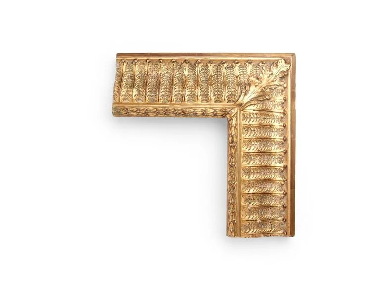 Leafed Stanford White An American 2-3/4 inch Stanford White-style frame, with a reeded inner lip, repeating acanthus leaf decorations throughout, and a leaf corner decoration. The finish shown is yellow gold with an antique finish and red-and-black clay.