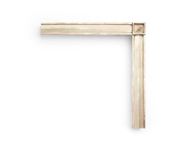 Slanted Panel Pyramid This 1-1/4 inch frame has a corner block with pyramidal inner panels, and slanted panels within the inner and outer frame lip. The finish shown is white gold with black speckling and a red clay.