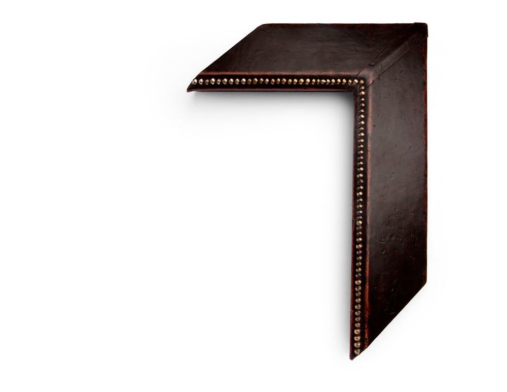Reverse Slanted Copper A 4 inch leather-wrapped frame, with copper-colored metal studs all along the inside lip, and a reverse slanted face. The finish is a deep brown natural leather with distressing at the edges. There are many finishes and leathers to choose from, and no two are exactly alike.