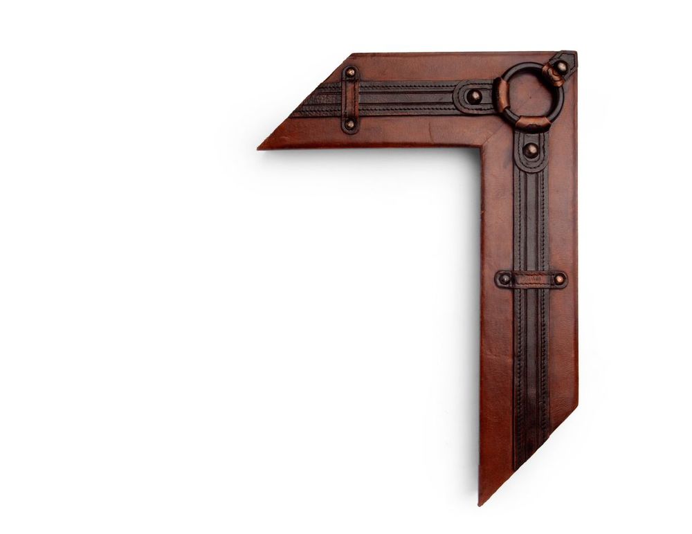 Bolted Steel Wrap A 4 inch leather-wrapped frame, with a heavy steel ring harness decoration at the corners, and bolted and secured along the natural leather panel. There are many finishes and leathers to choose from, and no two are exactly alike.