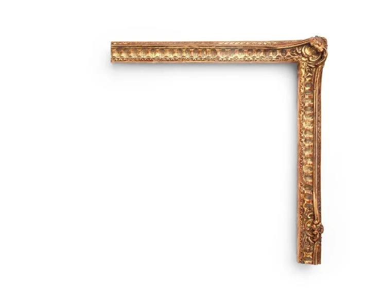 English Fluted Regency A French-inspired 1-1/2" English Regency-era frame, this narrow frame features carved rails meeting at floral-and-shell decorative corners and centers, fluting along the cove, and decoration on the outer and inner edges. The finish shown is yellow clay with a deep antique finish and red clay.