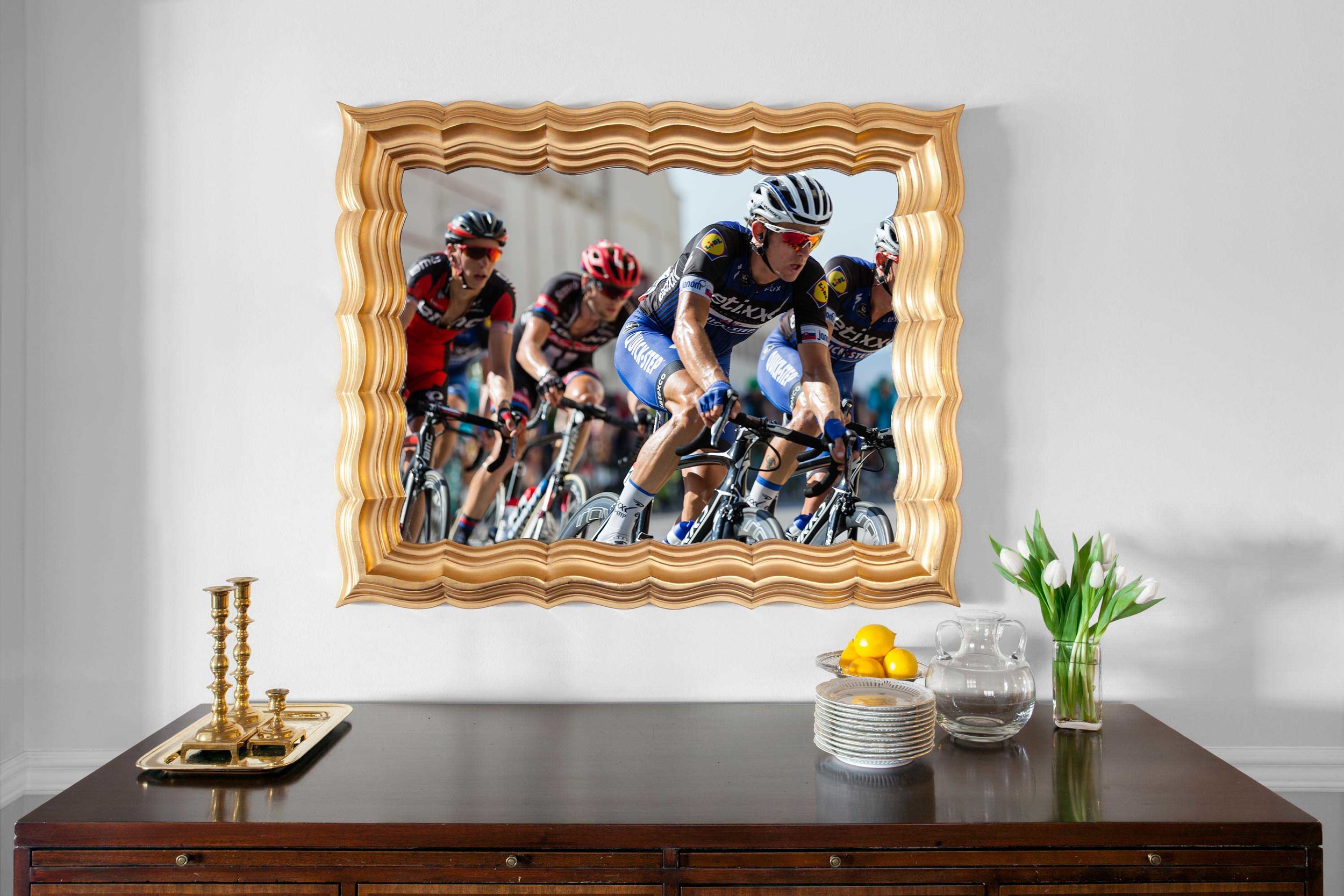 Decorative gold framed TV mirror handing over wooden console table