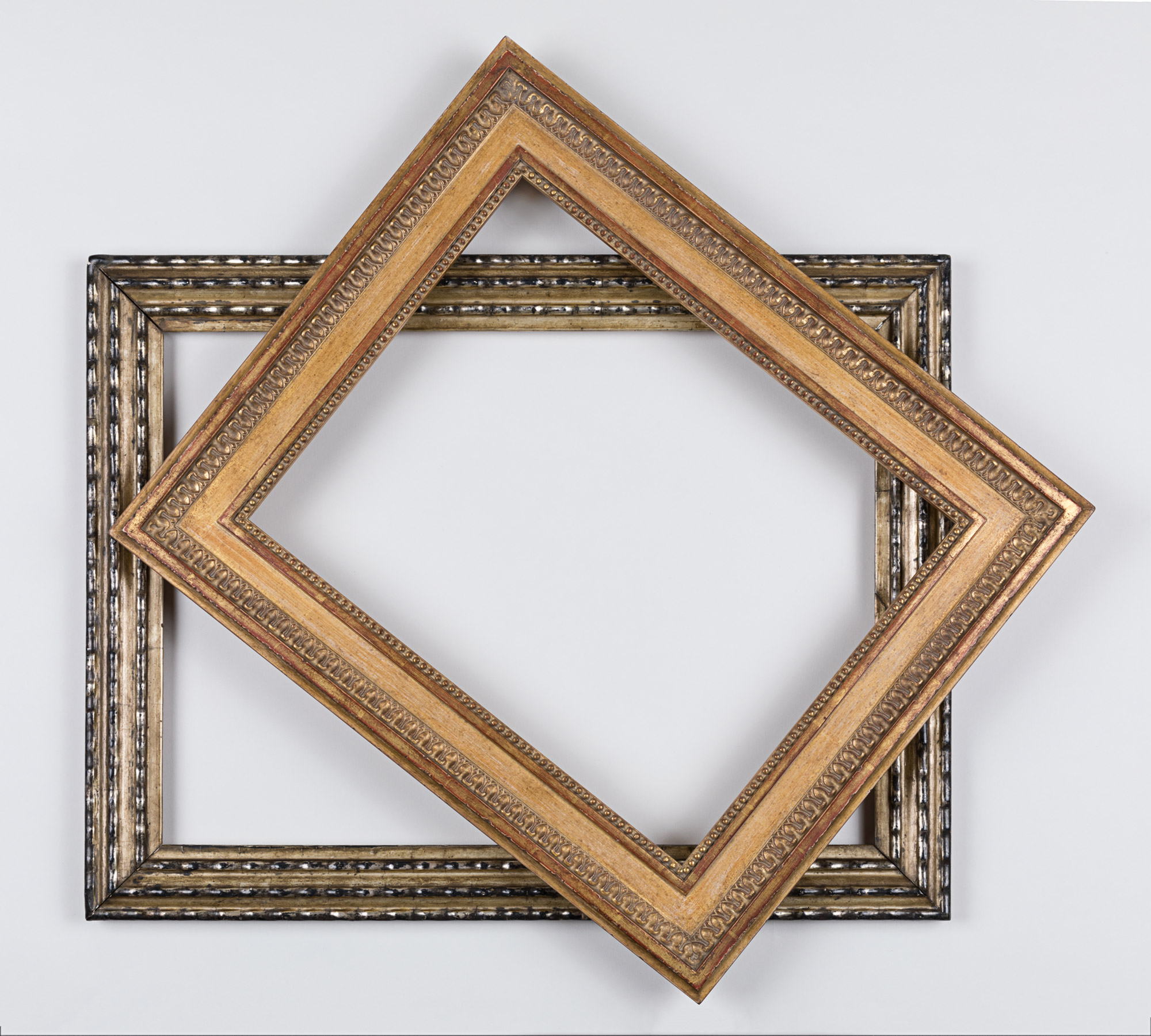 Two picture frames, stacked decoratively