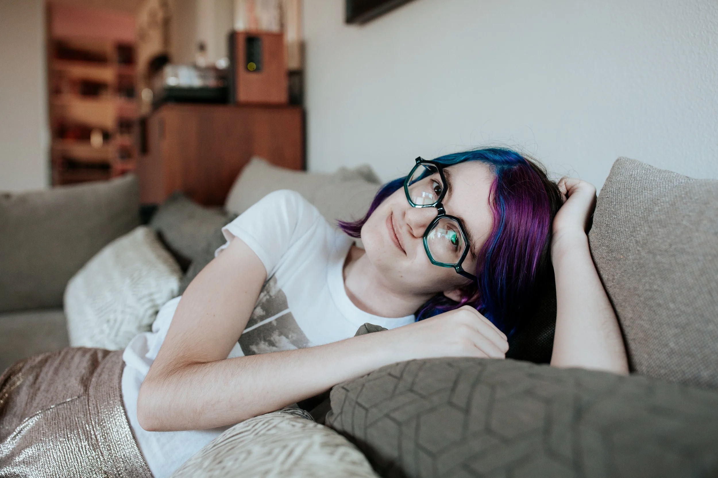 high school senior poses at home for senior pictures