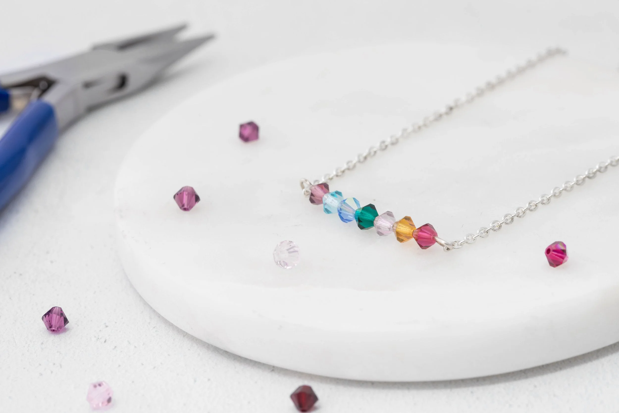 Make a Rainbow Bar Necklace - a free video tutorial from jewellers academy 