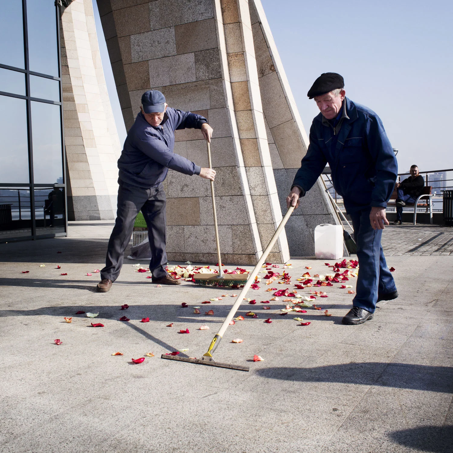 Men cleaning the doorstep between each wedding party.