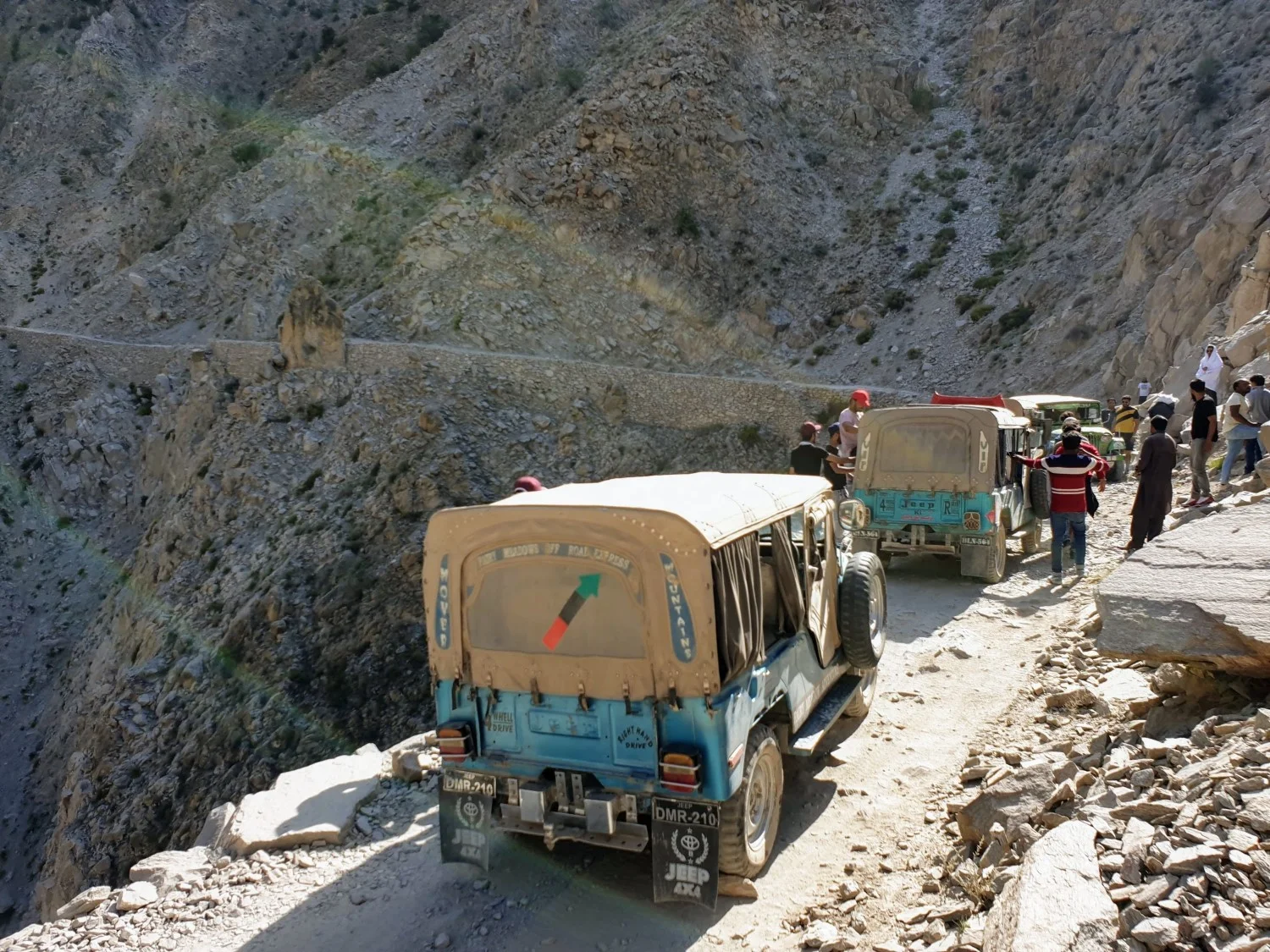 Waiting in a traffic jam as the drivers try and work out how to allow the oncoming jeeps to pass.