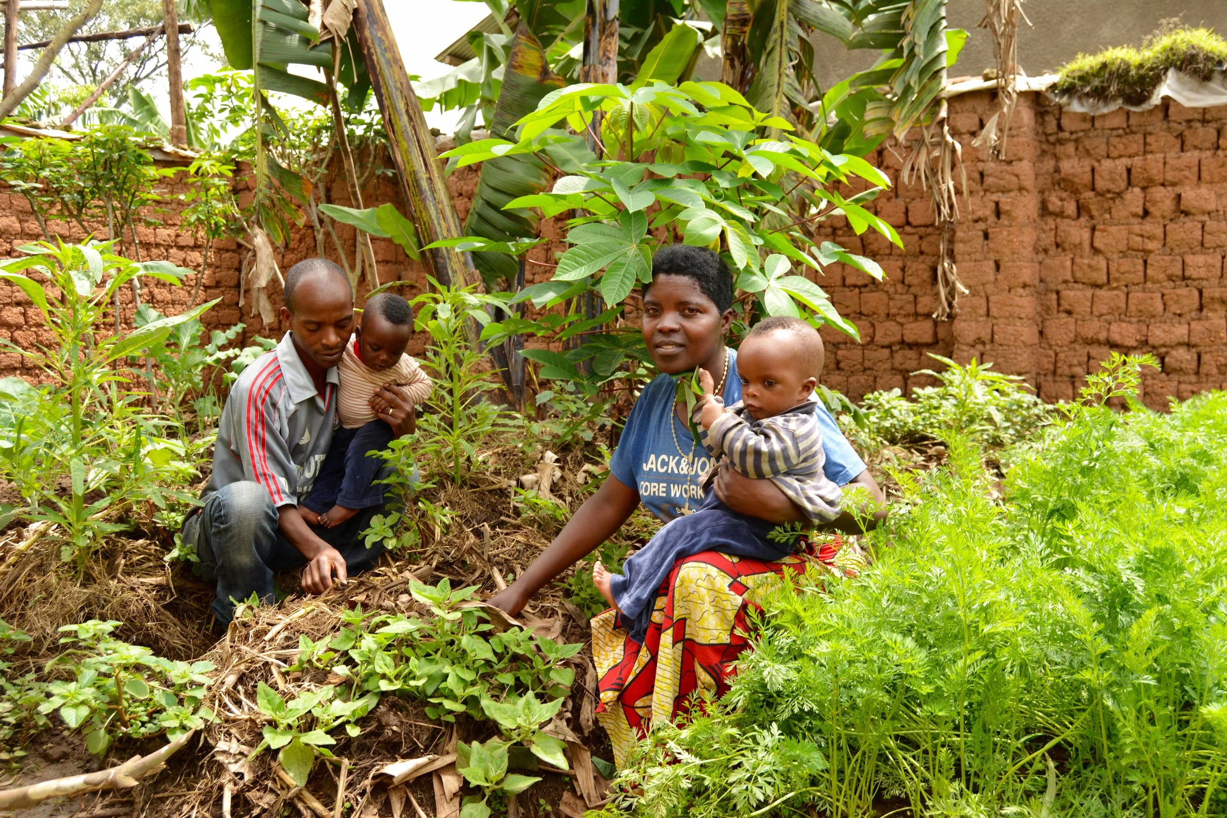 Jeanne d' Arc and her family in their home garden