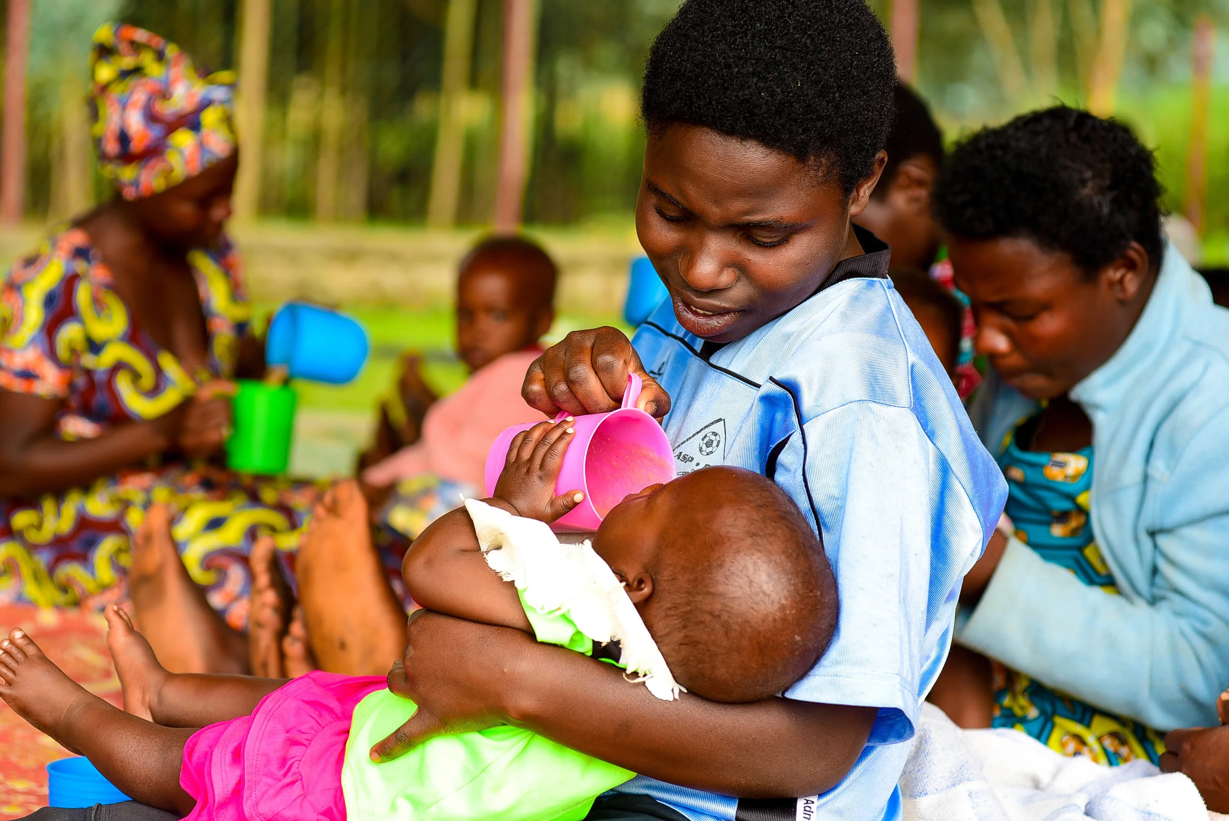A mother feeds her child Sosoma at a GHI health center training on family planning at the Musanze Health Center in Musanze, Rwanda. 