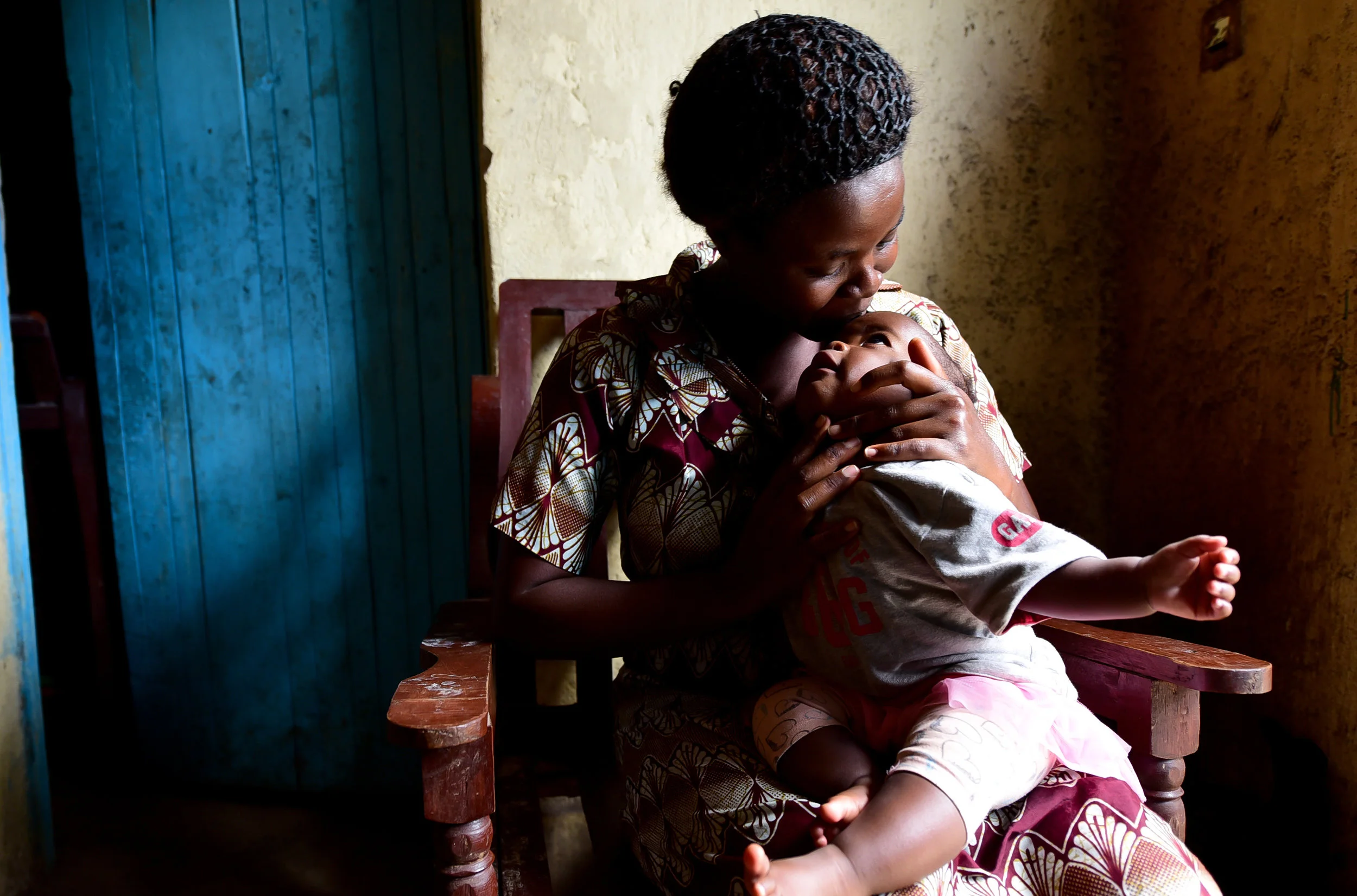 Nyirantezimama Apollinarie, recent graduate of GHI's health center program in Musanze, and her daughter Nyauisaba Ada Toddey. "She smiles and plays with other children now. This was not always happening before GHI," Apollinarie said of Toddey.
